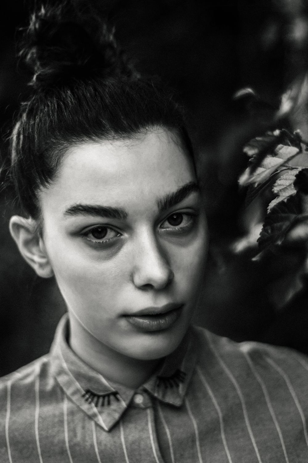 Black and White Portrait of a Young Woman Outdoors · Free Stock Photo