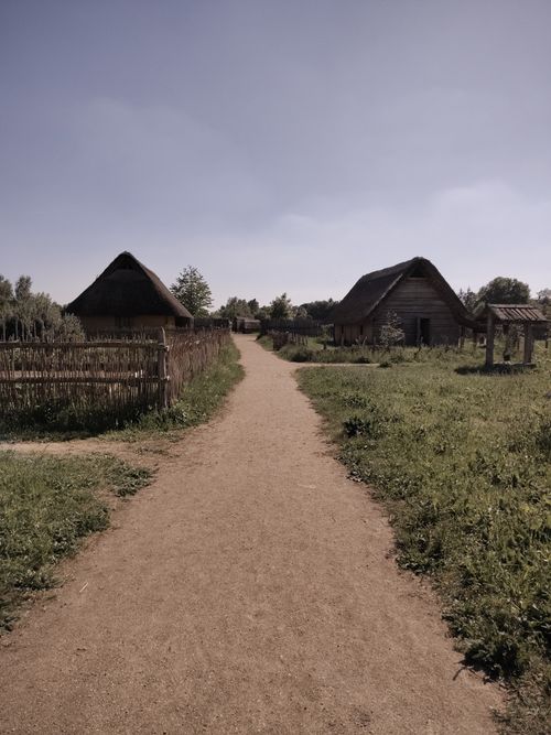 Free Dirt path through a serene traditional village landscape Stock Photo