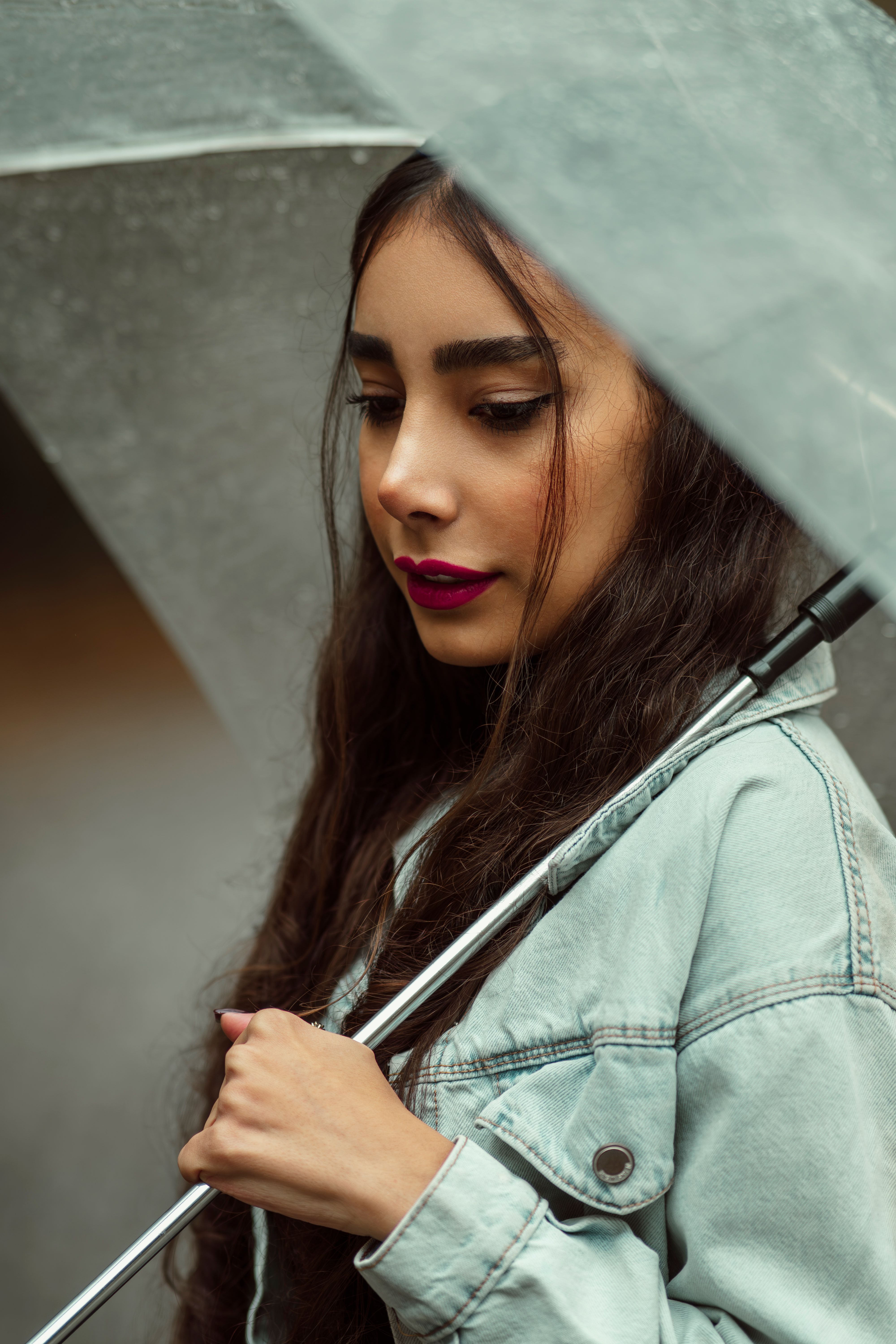 Elegant Woman in Tehran Holding Transparent Umbrella · Free Stock Photo