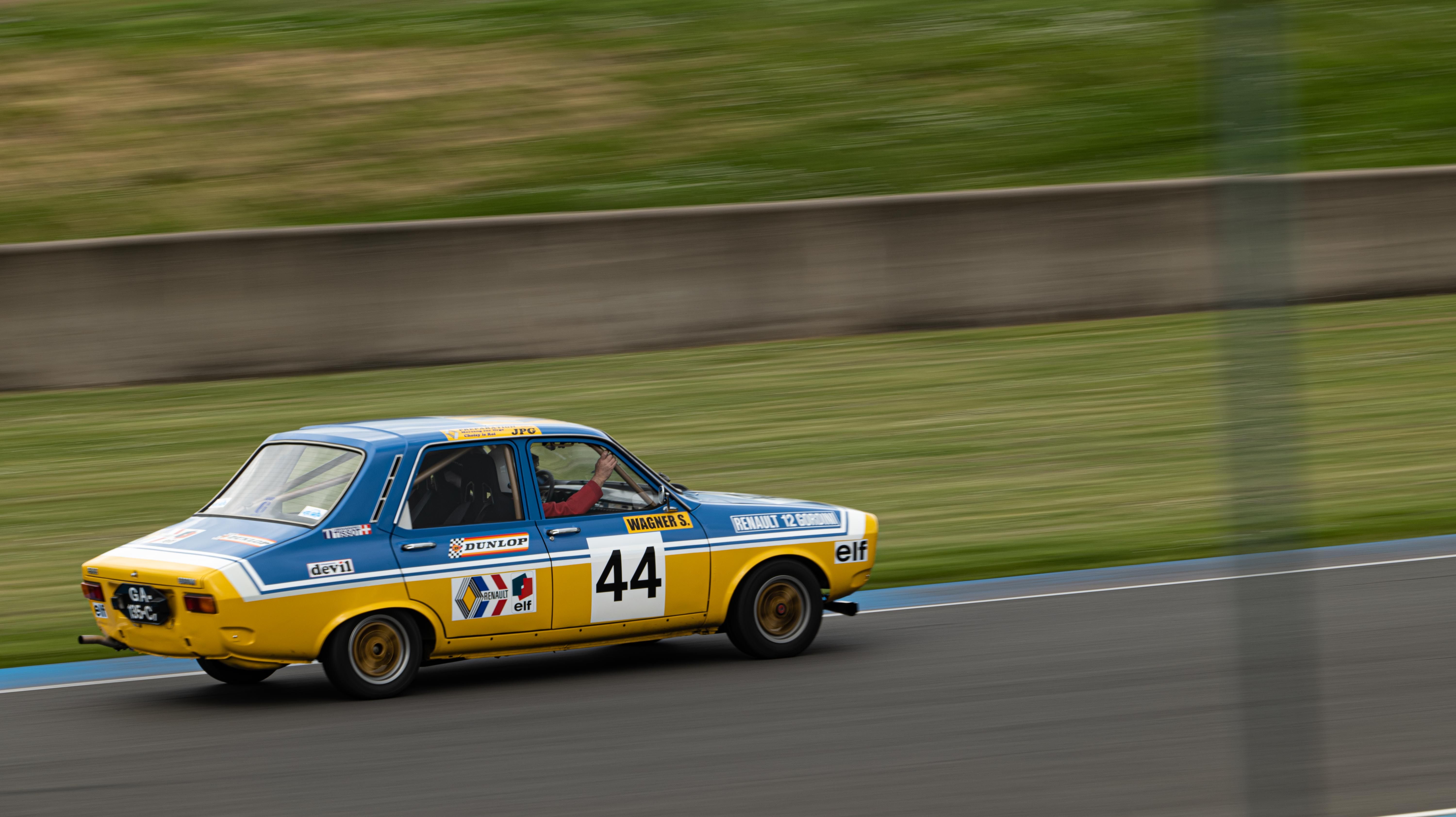 Vintage Race Car in Action on Track · Free Stock Photo