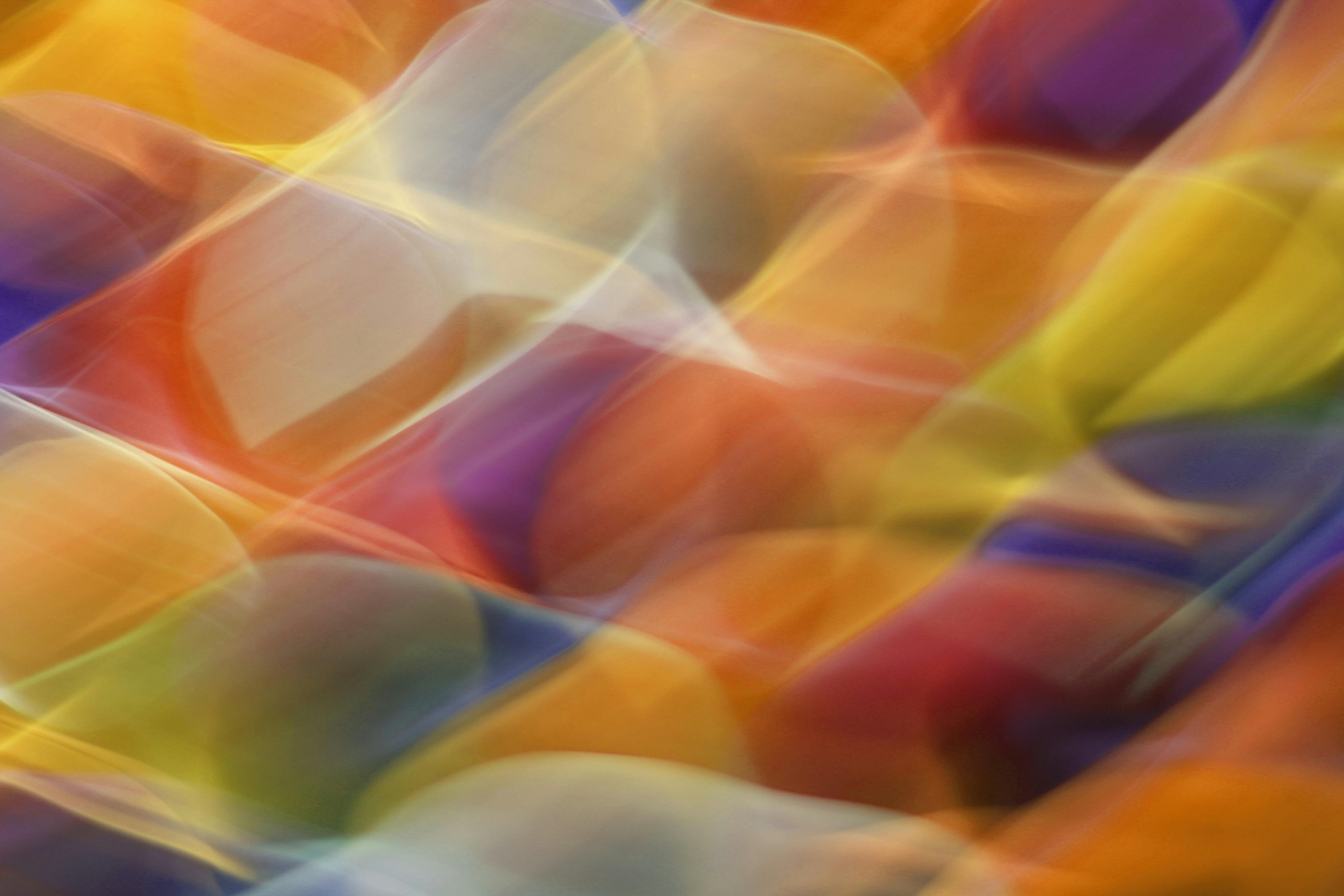 Colorful abstract art with dynamic light waves creating vibrant patterns in motion.