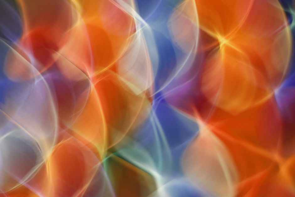 Colorful abstract art featuring vivid light reflections, creating a dynamic visual experience.