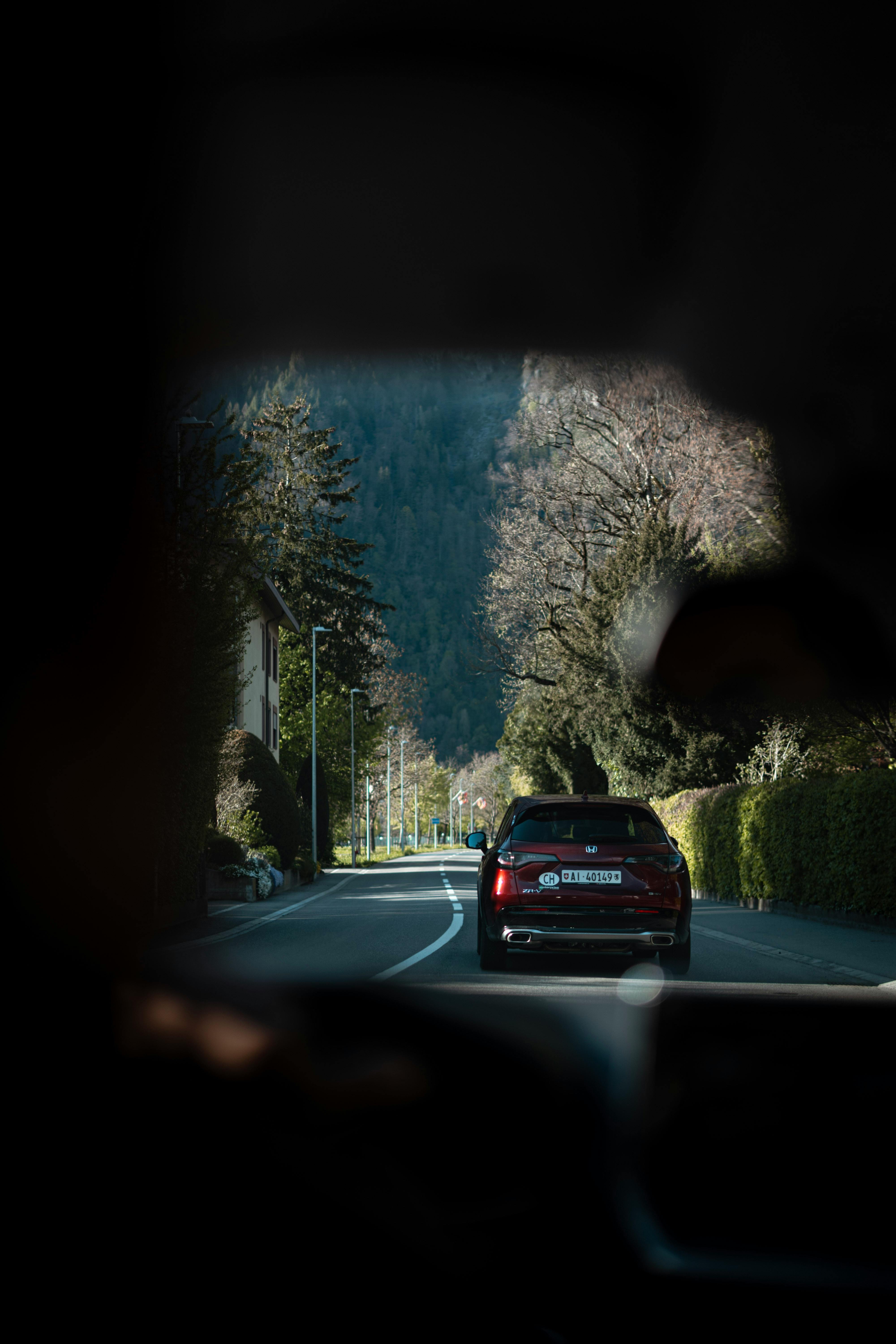 View from inside car on a scenic drive through the Swiss countryside.