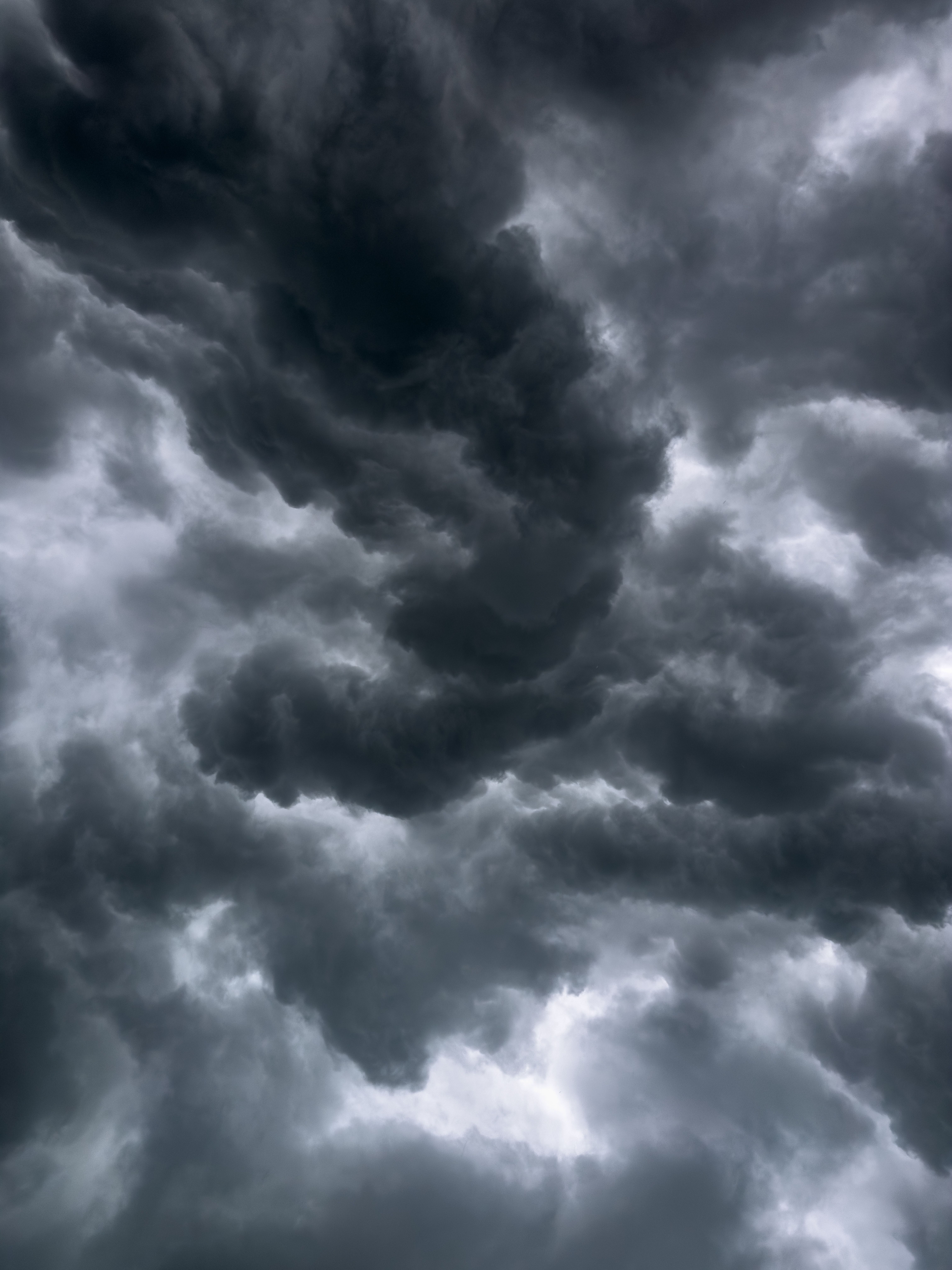 A moody sky filled with dramatic storm clouds, showcasing nature's power.. moody, filled, with