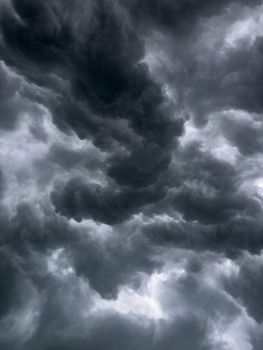 A moody sky filled with dramatic storm clouds, showcasing nature's power.. moody, filled, with