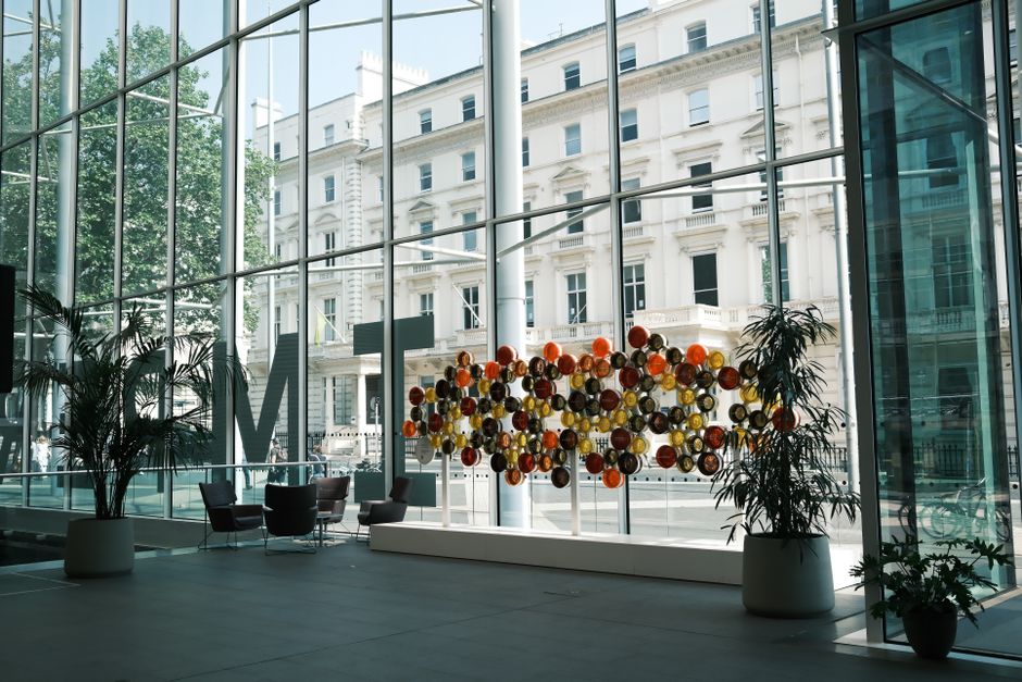 luxury high-rise lobby with modern art and concierge desk - high rise apartments luxury high-rise lobby with modern art and concierge desk - high rise apartments