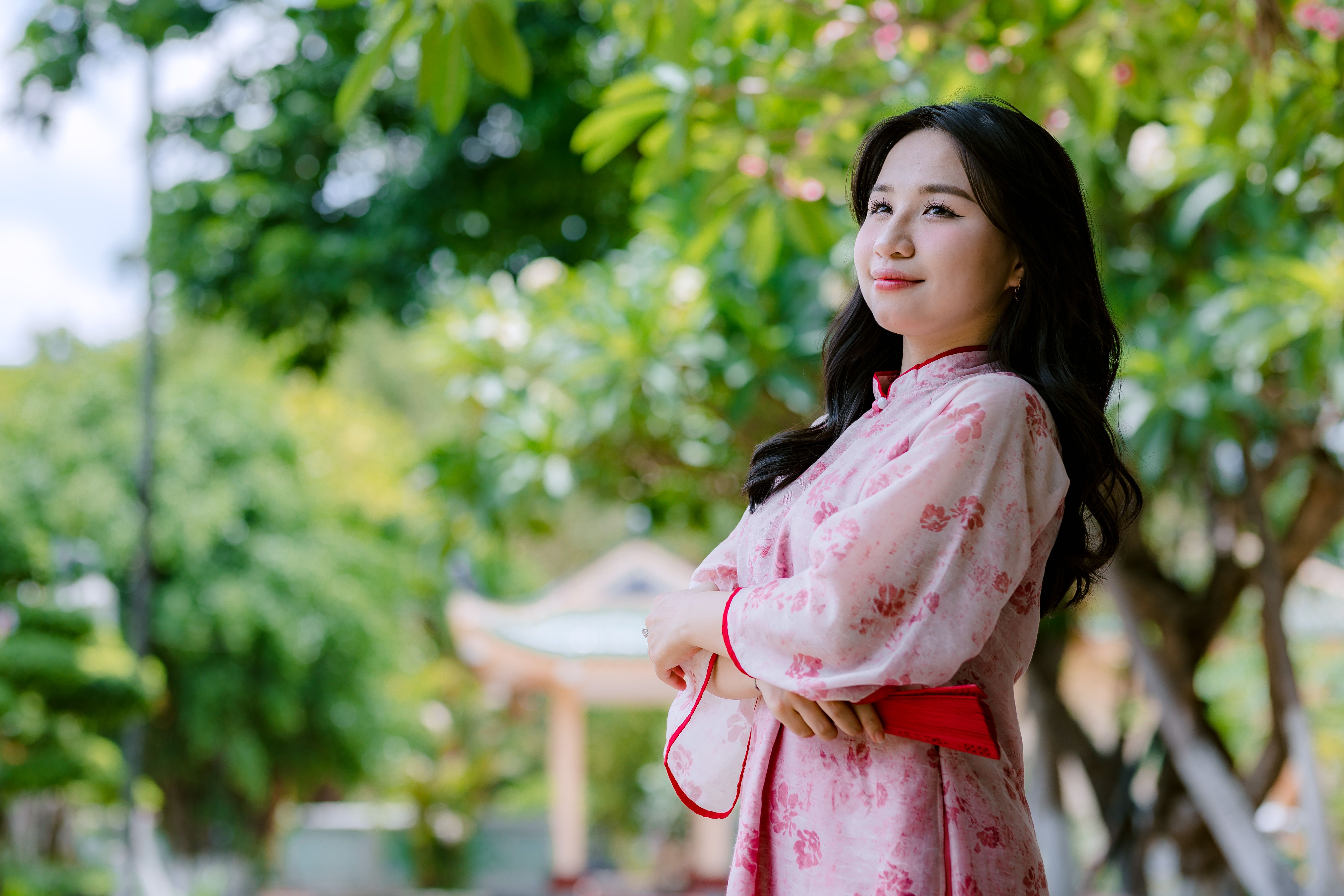 Young Woman in Traditional Dress Outdoors in Garden · Free Stock Photo