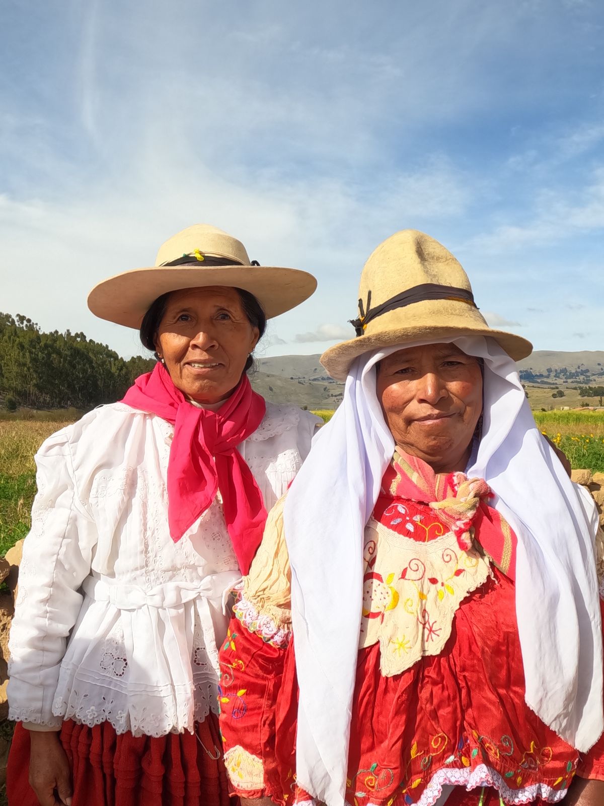 Two women in traditional Andean clothing in rural Bolivia