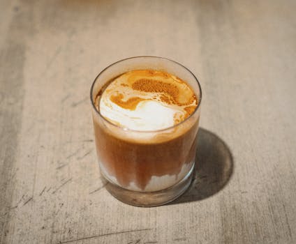 Aromatic glass of espresso with a beautiful creamy swirl, captured in Shinjuku, Tokyo.