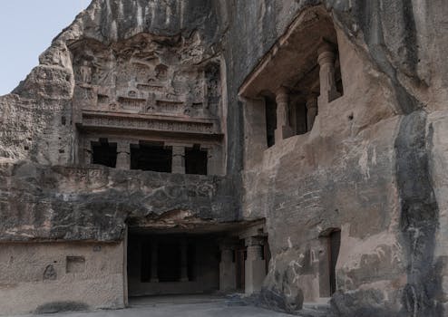 Discover the intricate rock-cut architecture of the ancient Ellora Caves in Maharashtra, India.