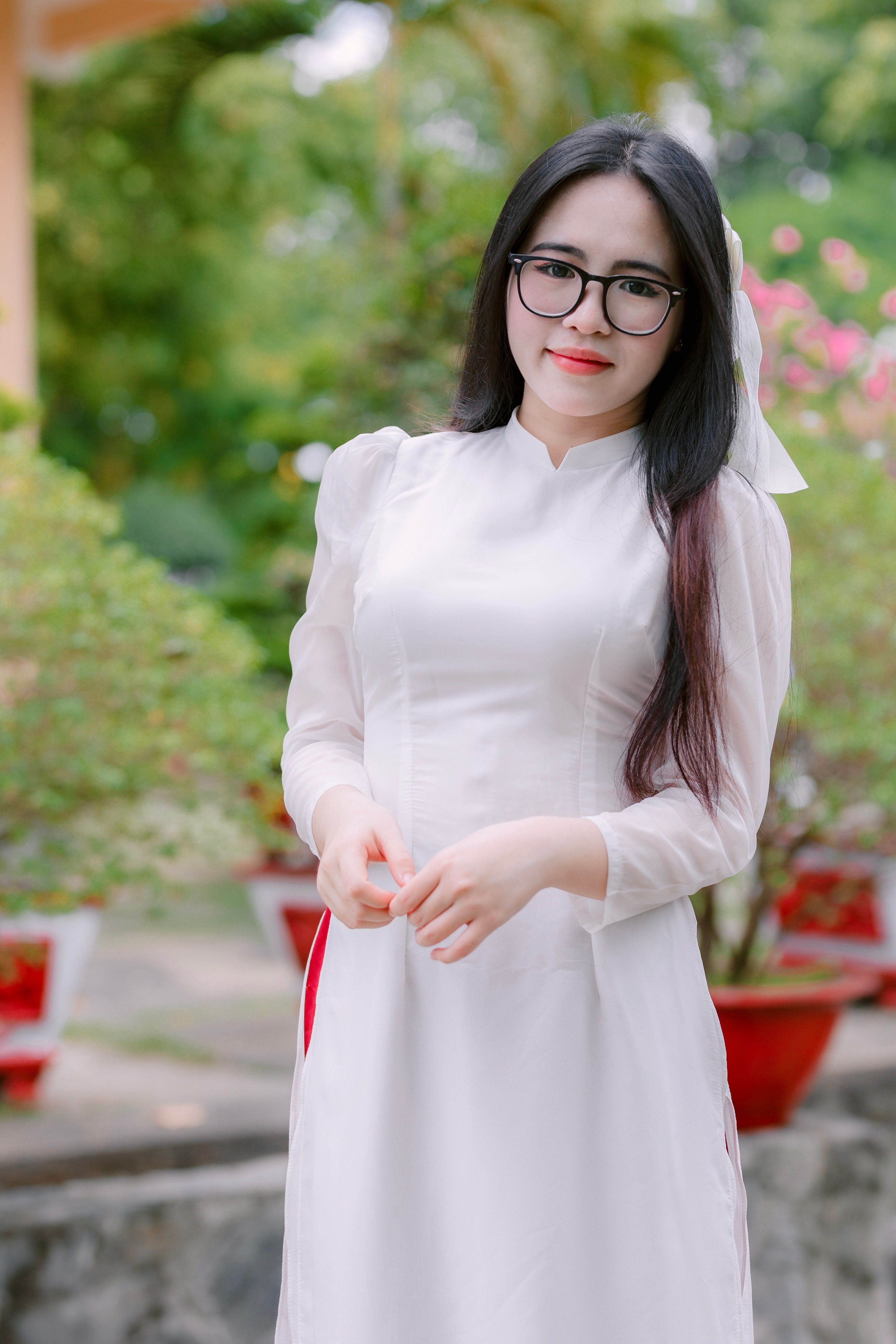 Young Woman in Traditional White Dress Outdoors · Free Stock Photo