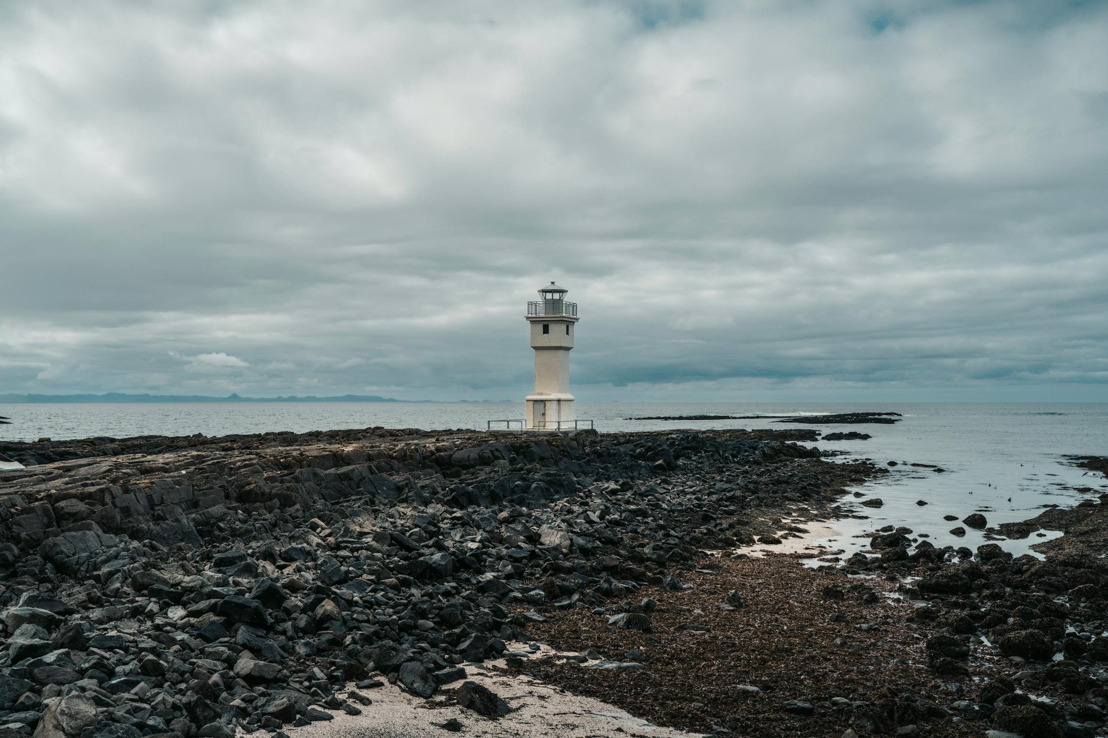 Isolated Icelandic Lighthouse on Rocky Coastline cleanest drinking water