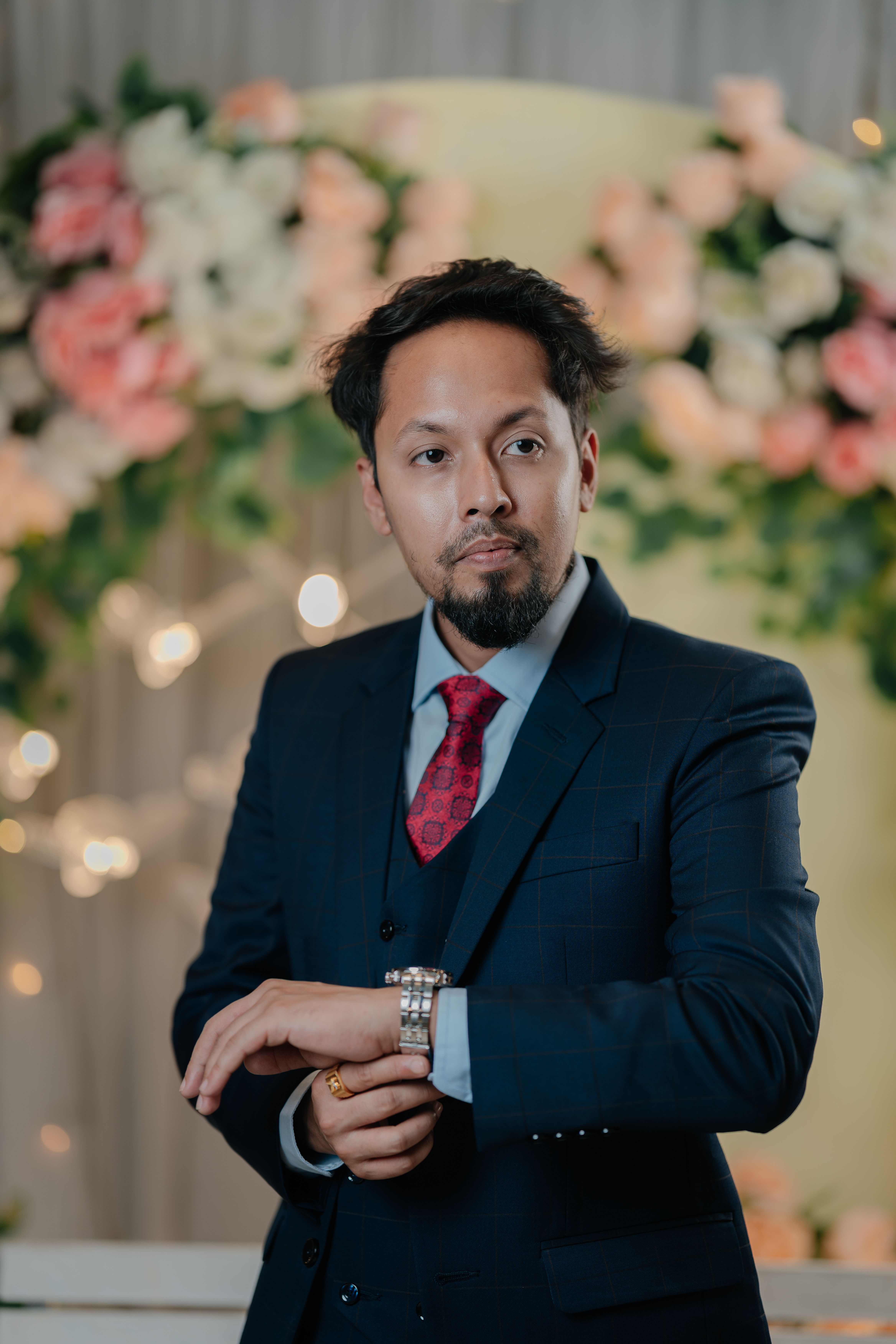 Elegant Portrait of Man in Floral Setting · Free Stock Photo