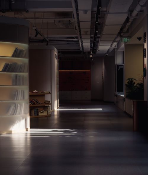 Free An empty modern library with bookshelves and soft lighting. Calm and quiet atmosphere. Stock Photo