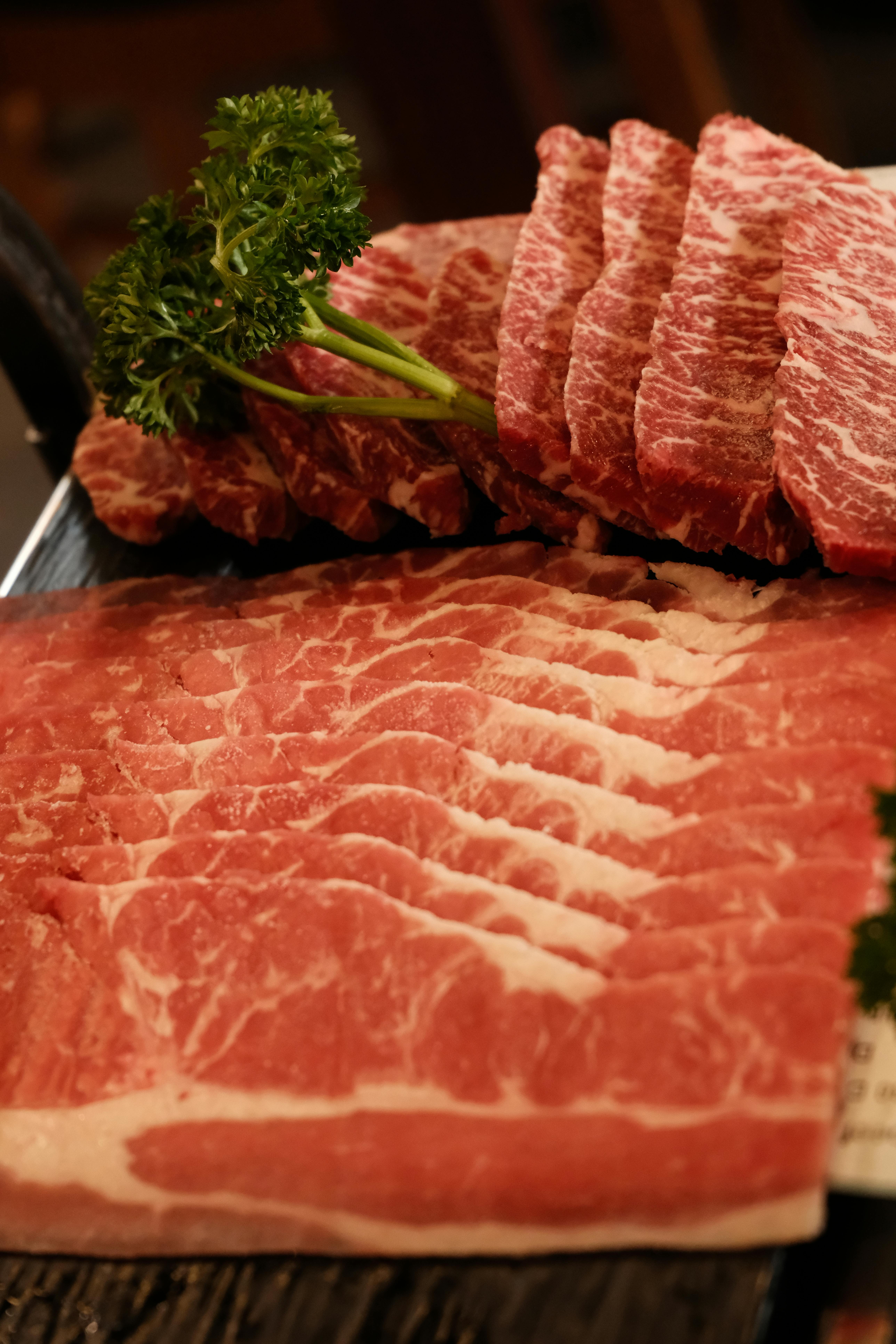 Chef preparing ingredients for sherried beef recipe in a rustic kitchen