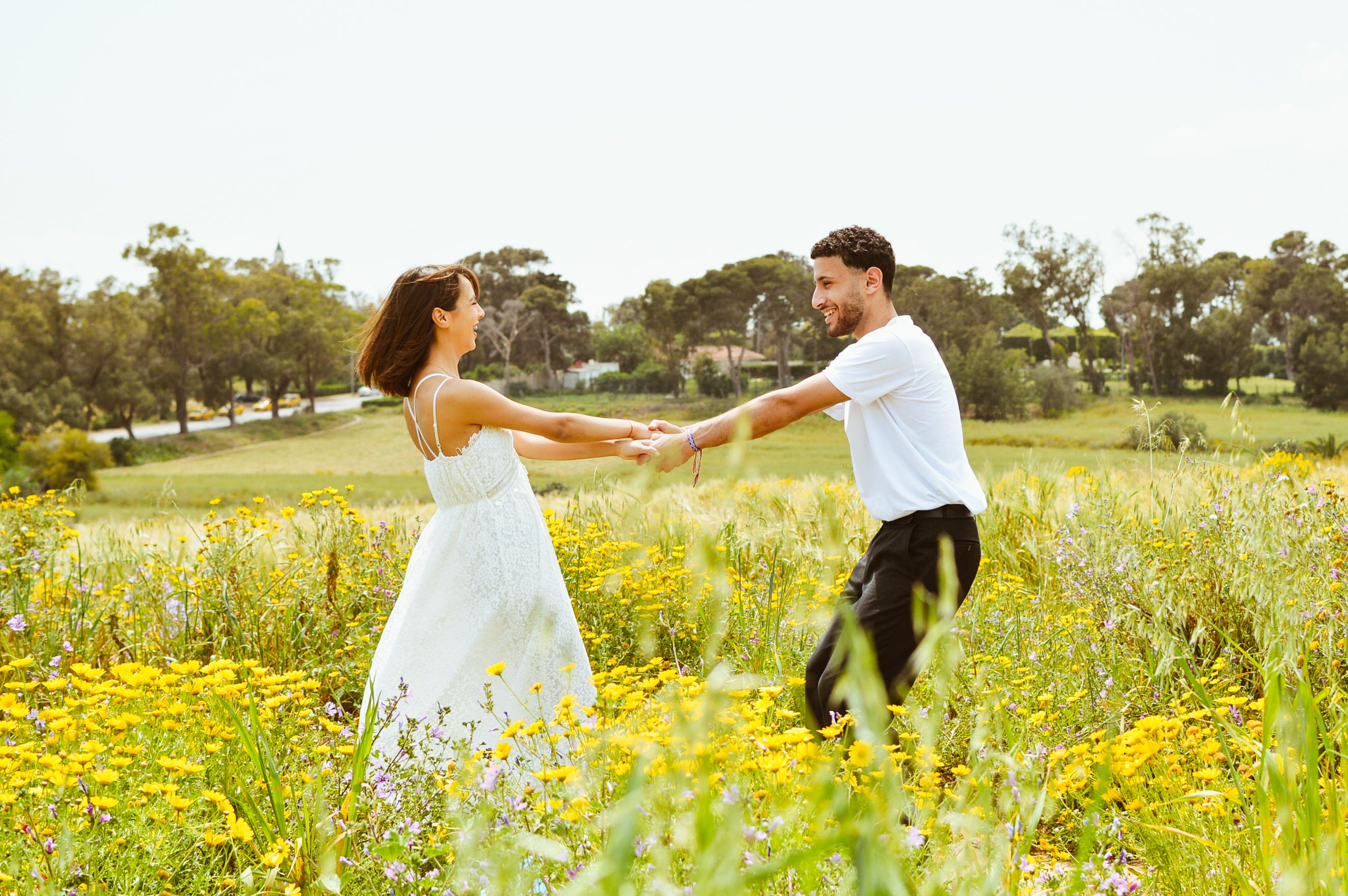 Joyful Couple Dancing in Spring Meadow · Free Stock Photo