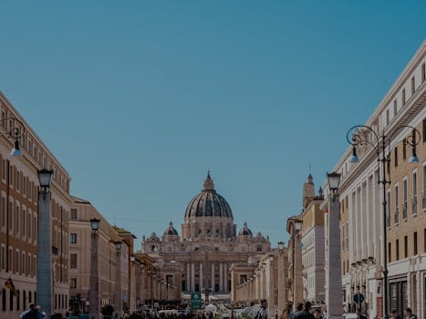A vibrant view of St. Peter's Basilica in Vatican City with bustling street life.