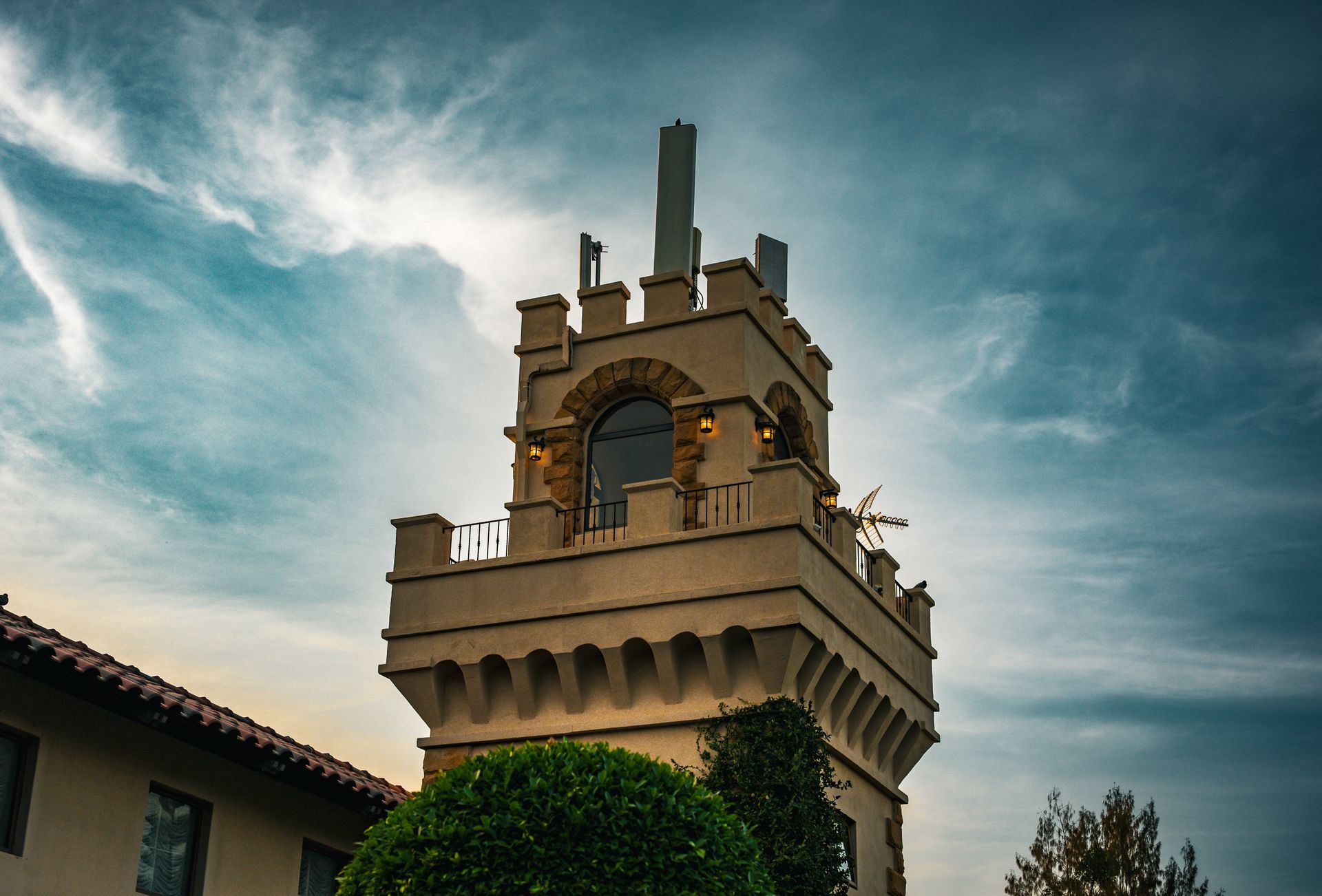 A beautiful architectural tower in Thailand with a dramatic sky backdrop, capturing classic elegance.
