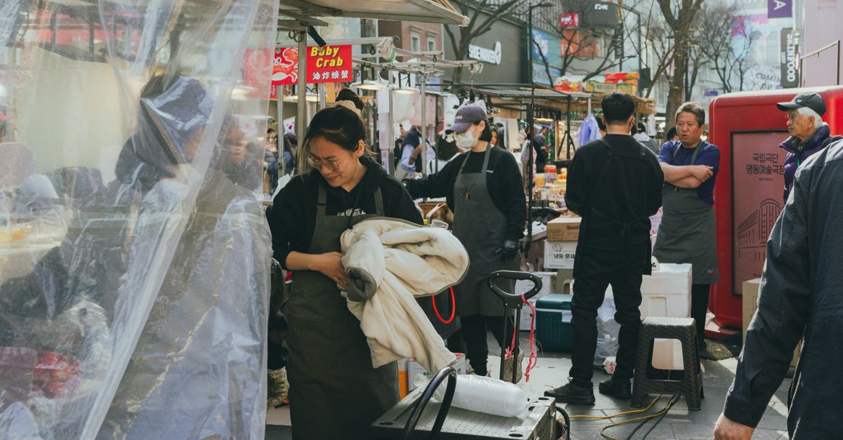 Explore the lively street market scene in Myeongdong, Seoul, showcasing Korean culture and culinary delights. visual (Photo: Theodore Nguyen / Pexels)
