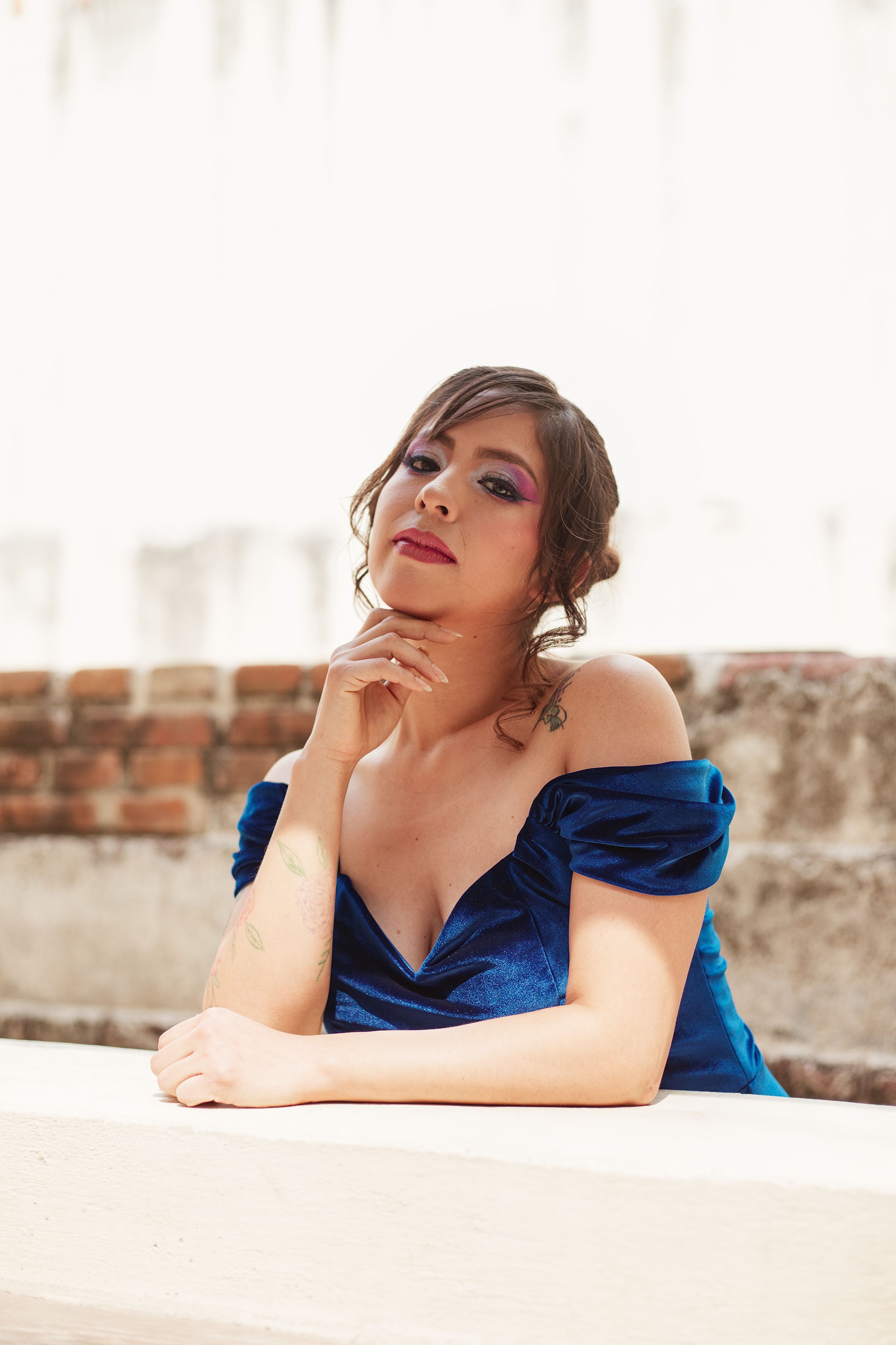 Elegant Woman Posing in Blue Dress Outdoors · Free Stock Photo