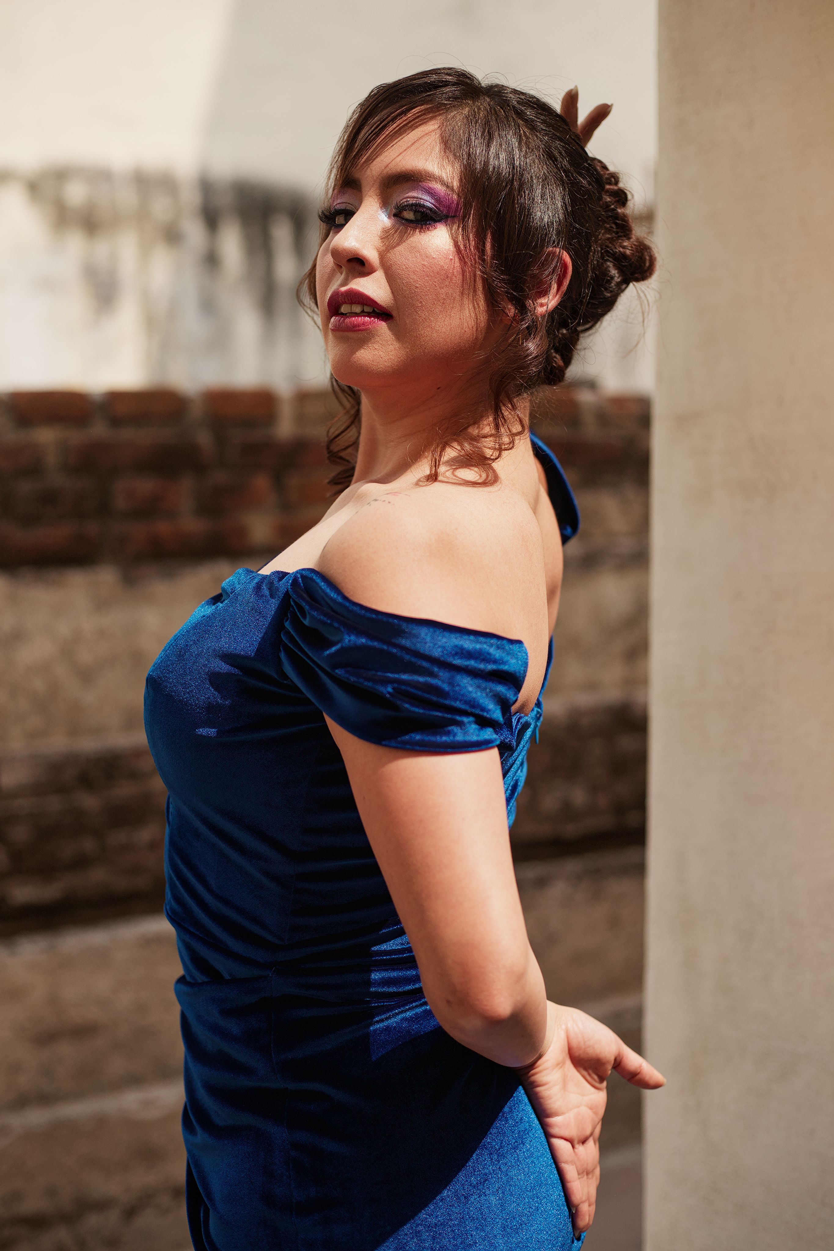 Elegant Woman in a Blue Dress Outdoors · Free Stock Photo