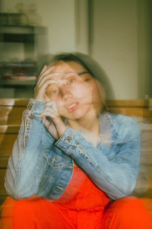 long Exposure Photo Of A Young Girl Sitting Wearing Denim Jacket