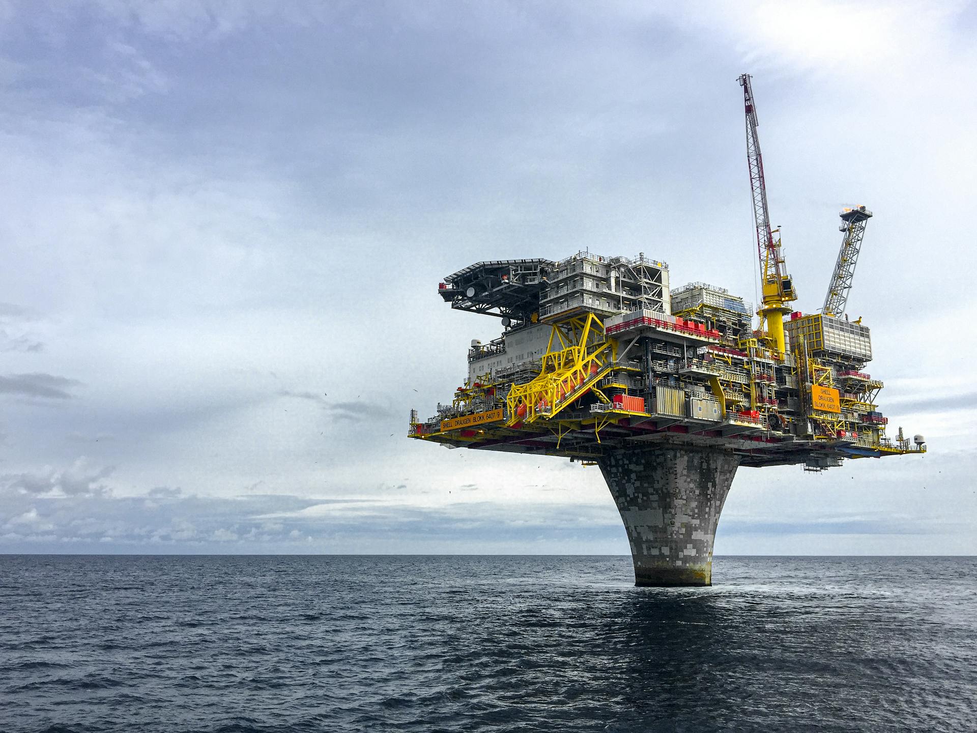 Dramatic view of a large oil platform in Norway's North Sea, symbolizing offshore industry.