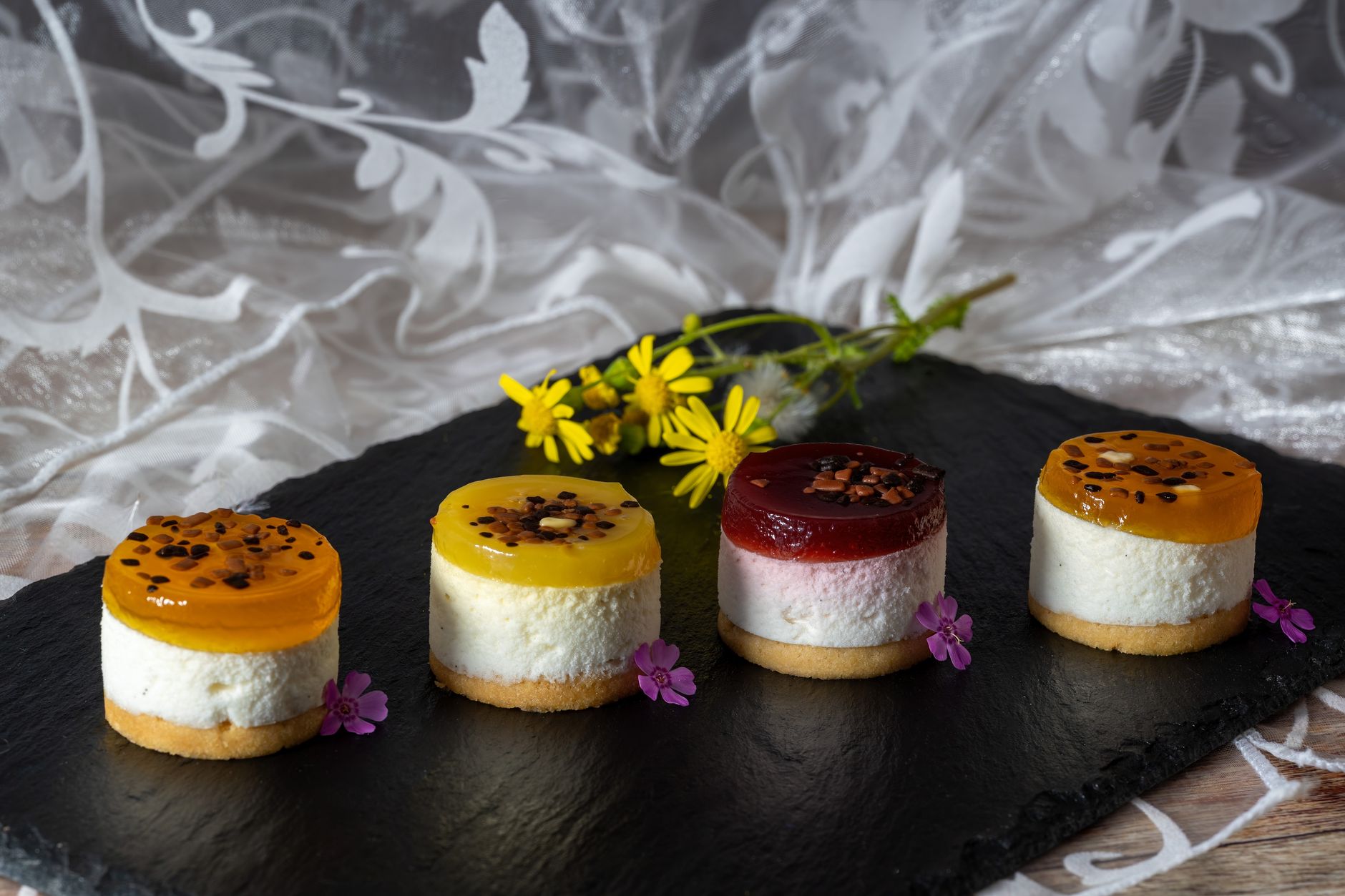 Mini cheesecakes in muffin tray setting in refrigerator