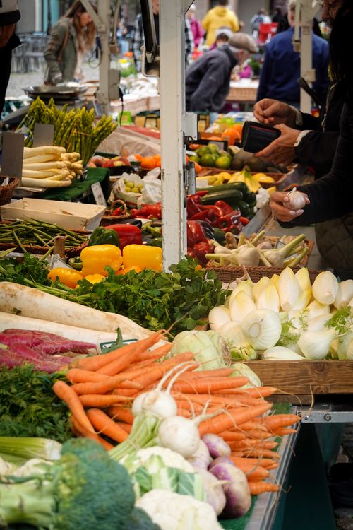 Free Colorful fresh produce at a bustling outdoor farmers market, showcasing variety and abundance. Stock Photo