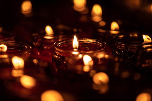 Free Romantic soft-focus candlelight creating a warm, cozy ambiance in the dark. Stock Photo