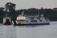 A picturesque view of two ferries crossing near Nusa Tenggara Barat, showcasing maritime life in Indonesia.