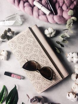 Chic flat lay featuring elegant accessories on a textured background, ideal for fashion themes.