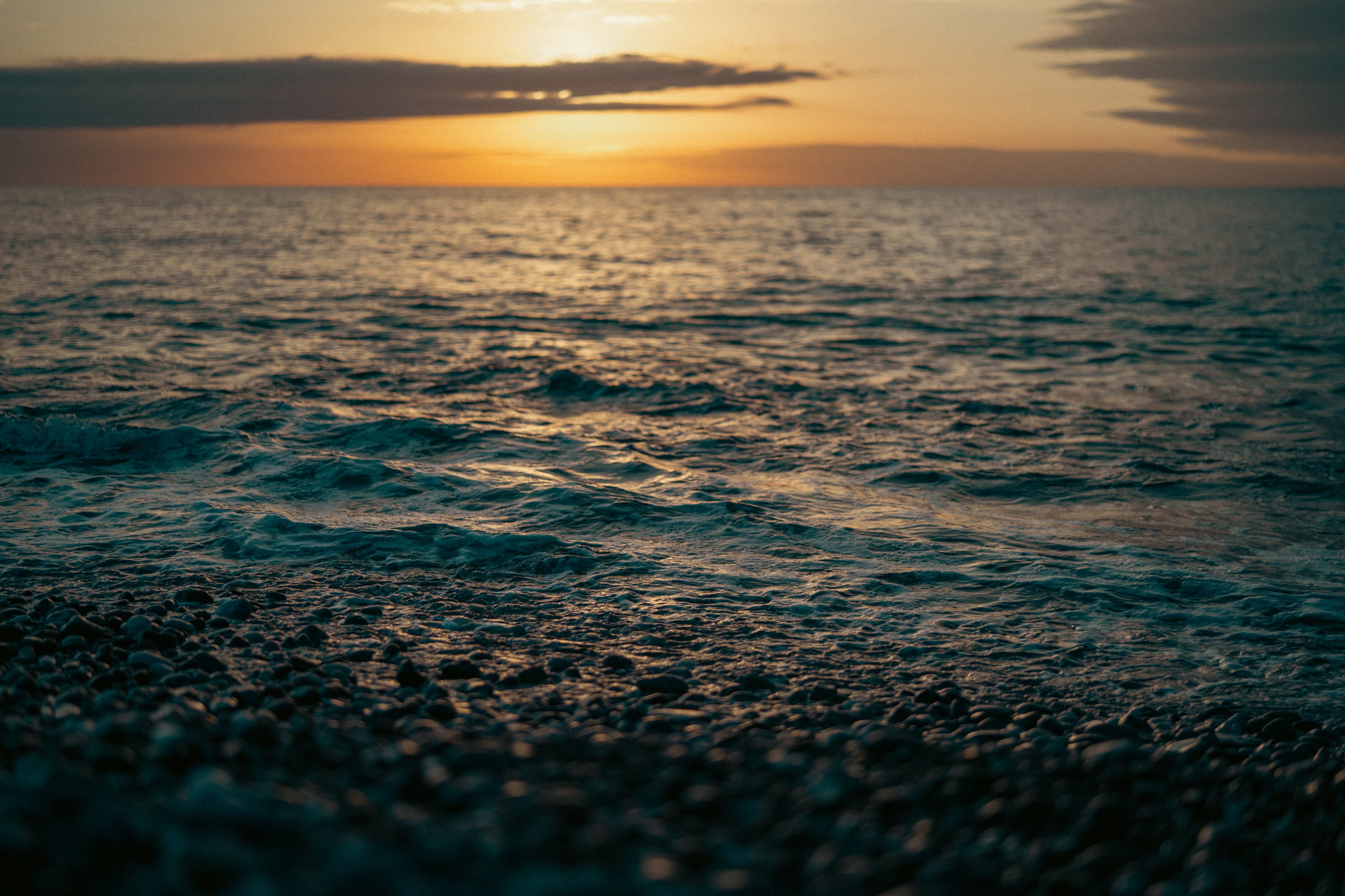 Tranquil Ocean Waves at Golden Sunset · Free Stock Photo