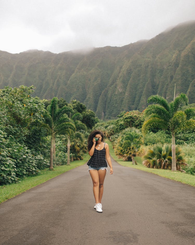 Woman Walking On Road