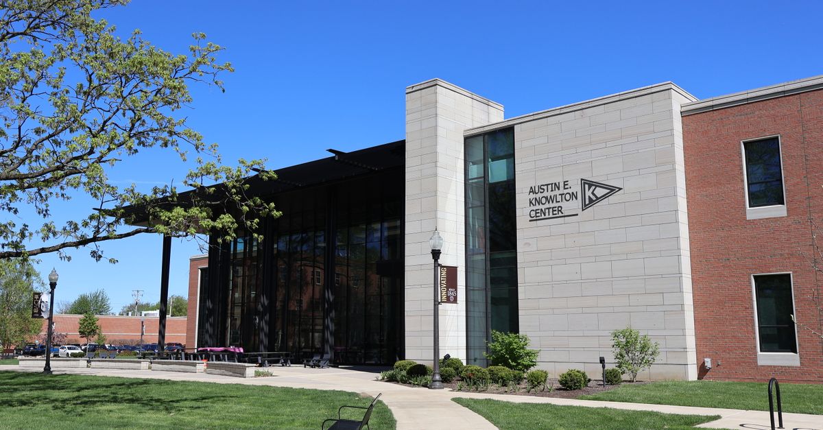Bright sunny view of the Austin E. Knowlton Center building exterior in Berea, Ohio, surrounded by green lawns and trees.