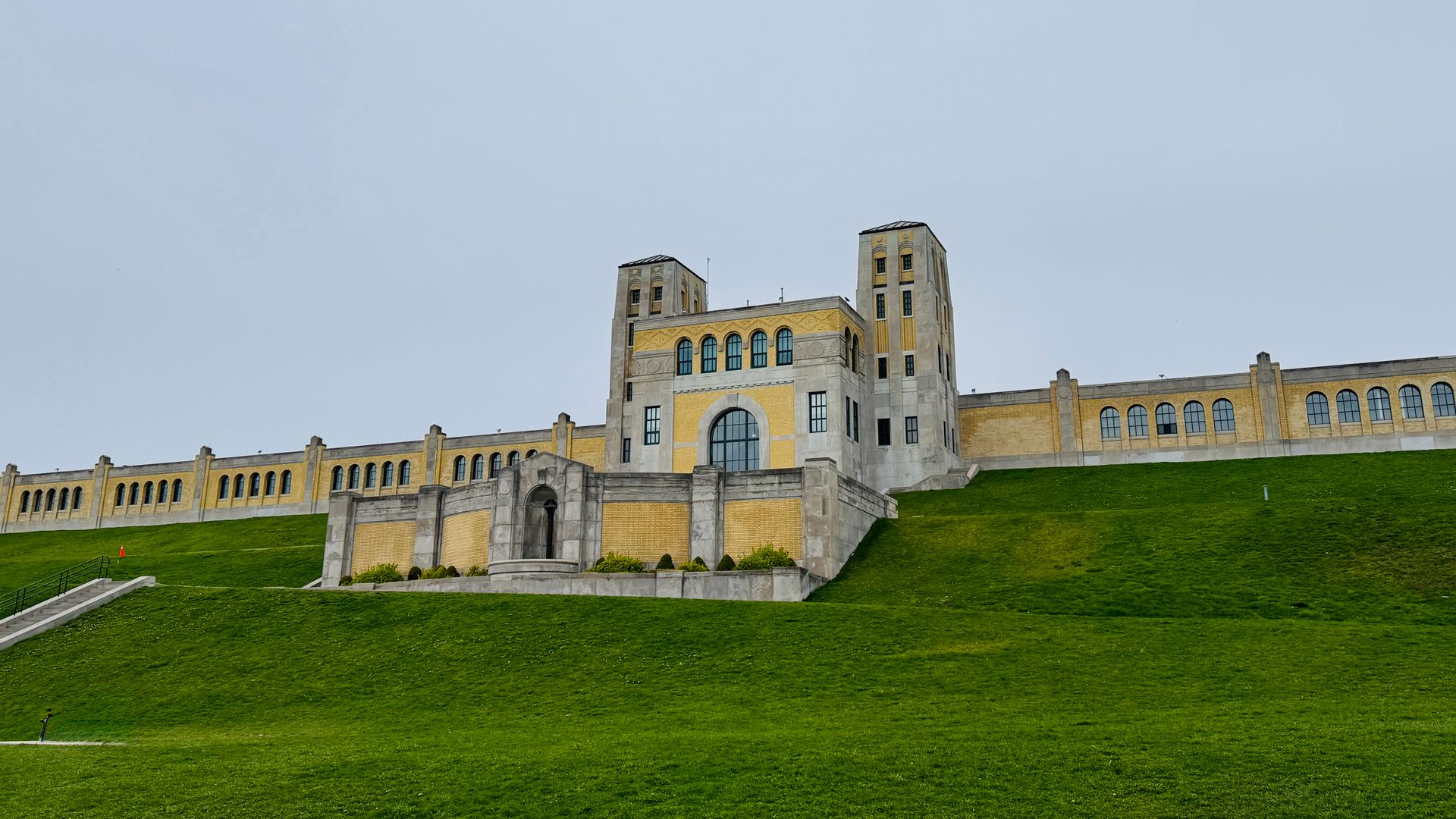 Elegant capture of the R. C. Harris Water Treatment Plant with lush green foreground on a cloudy day.
