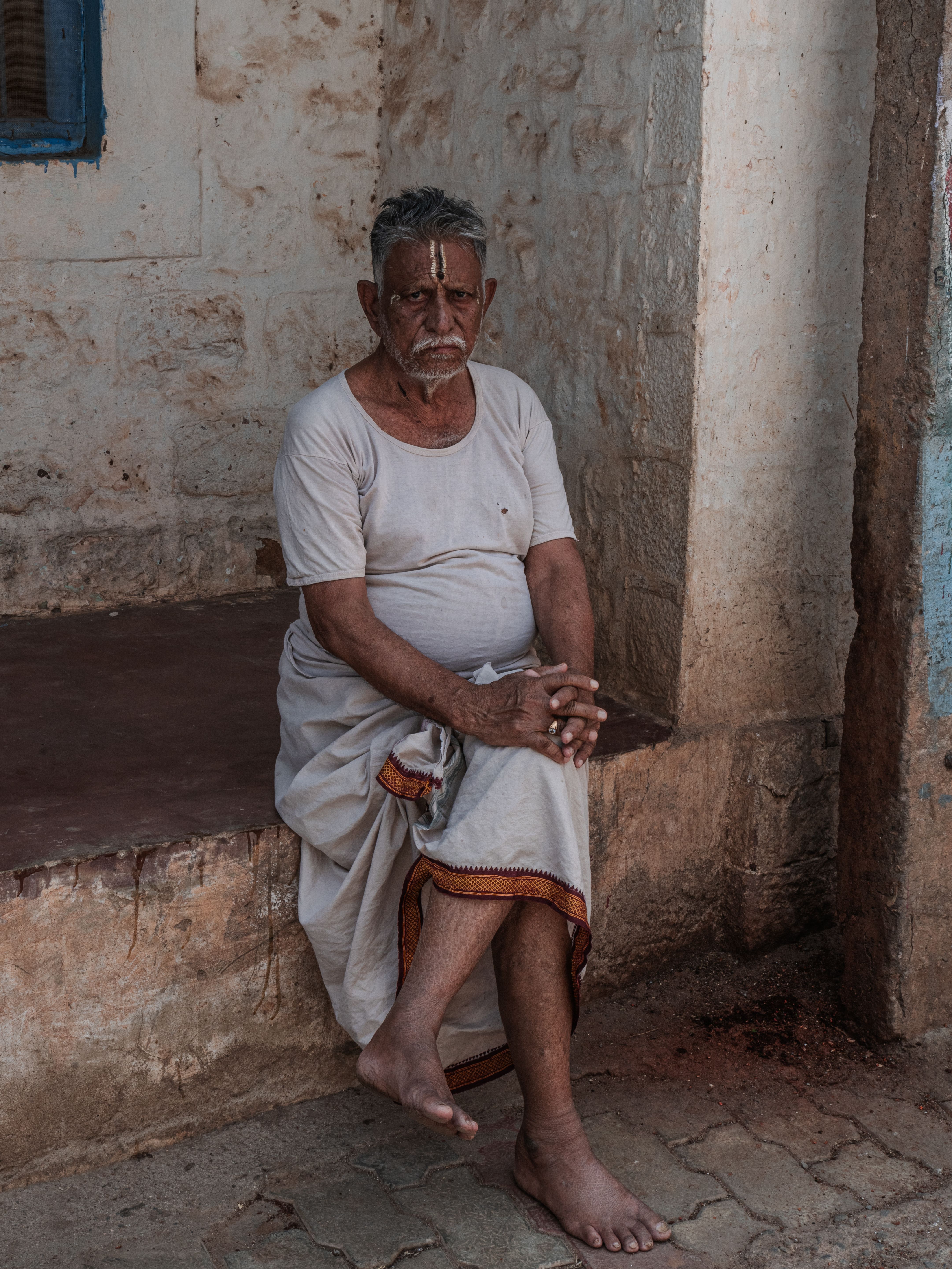 Elderly Man Sitting in Traditional Indian Attire · Free Stock Photo