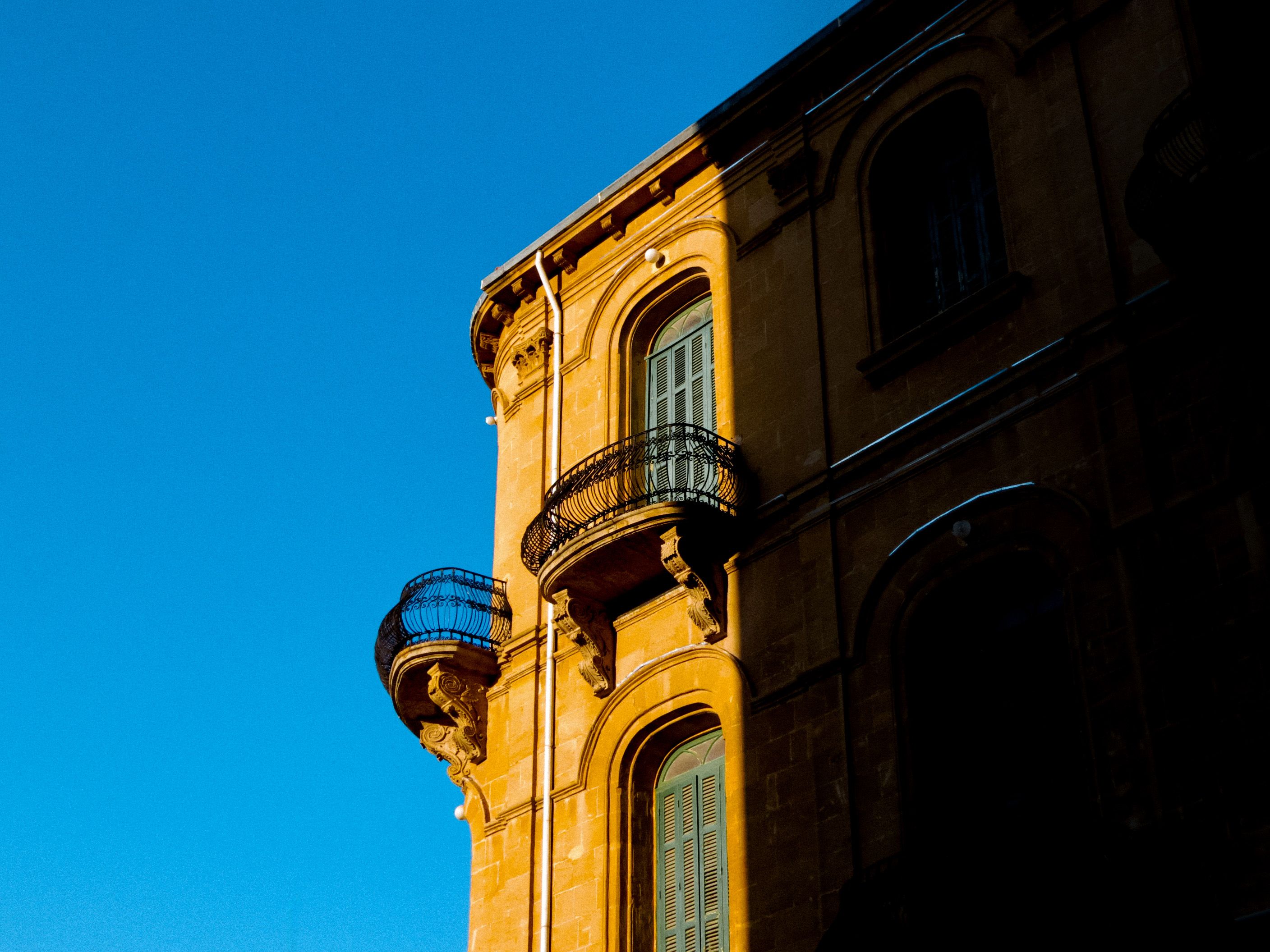 Golden Hour on Historic Building Facade · Free Stock Photo