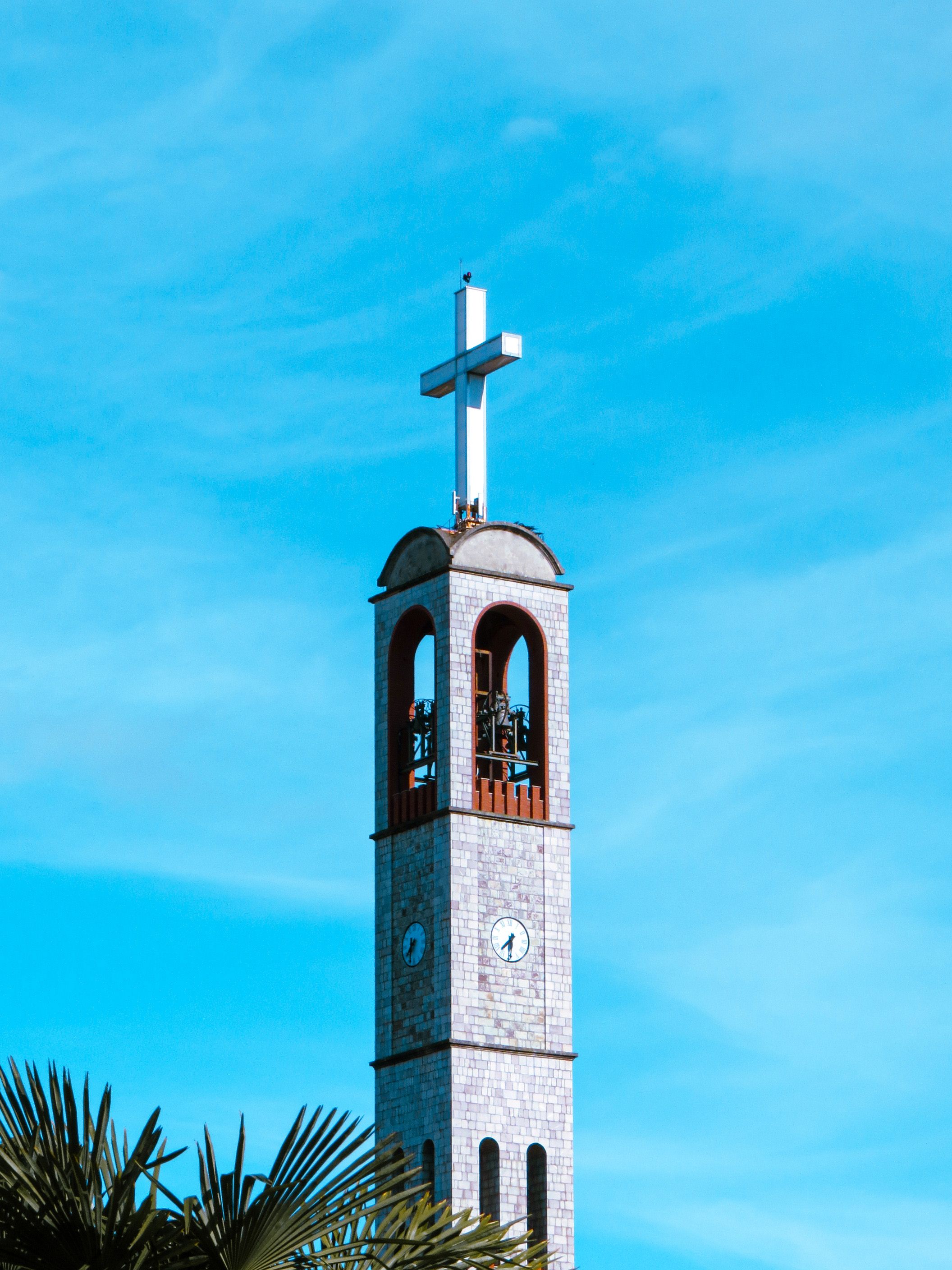Stunning Church Bell Tower Against Blue Sky · Free Stock Photo