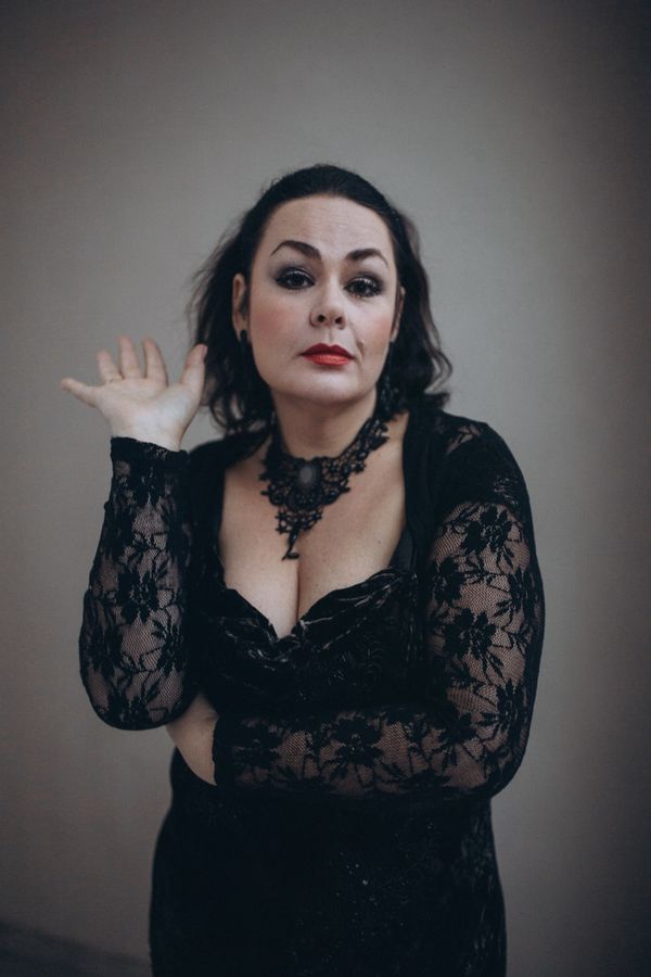 Elegant woman in a black lace dress portrait