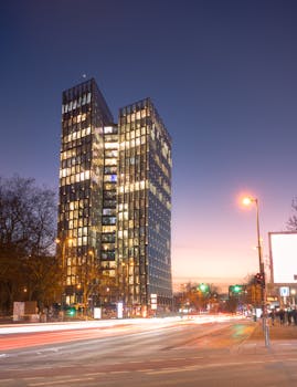 Captivating view of Hamburg's Dancing Towers at twilight with light streaks enhancing the urban landscape.