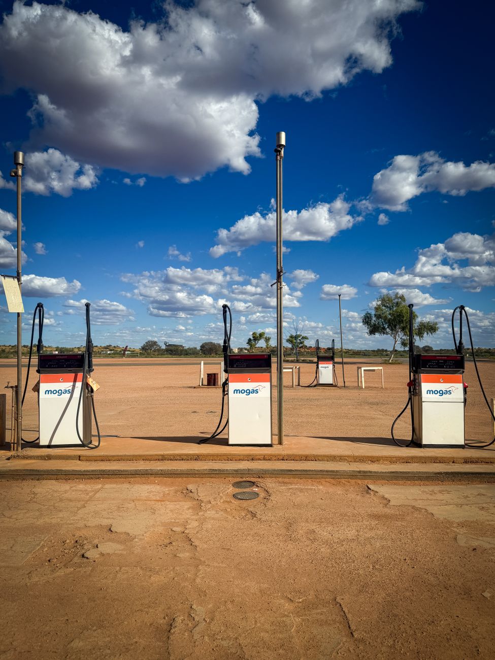 Remote fuel station under a clear blue sky in the Australian outback