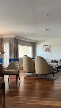 Spacious living room featuring modern furniture and a cozy ambiance, perfect for relaxation.