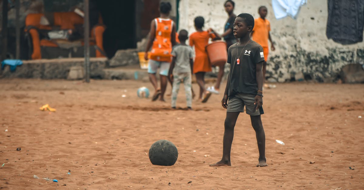African boy playing football