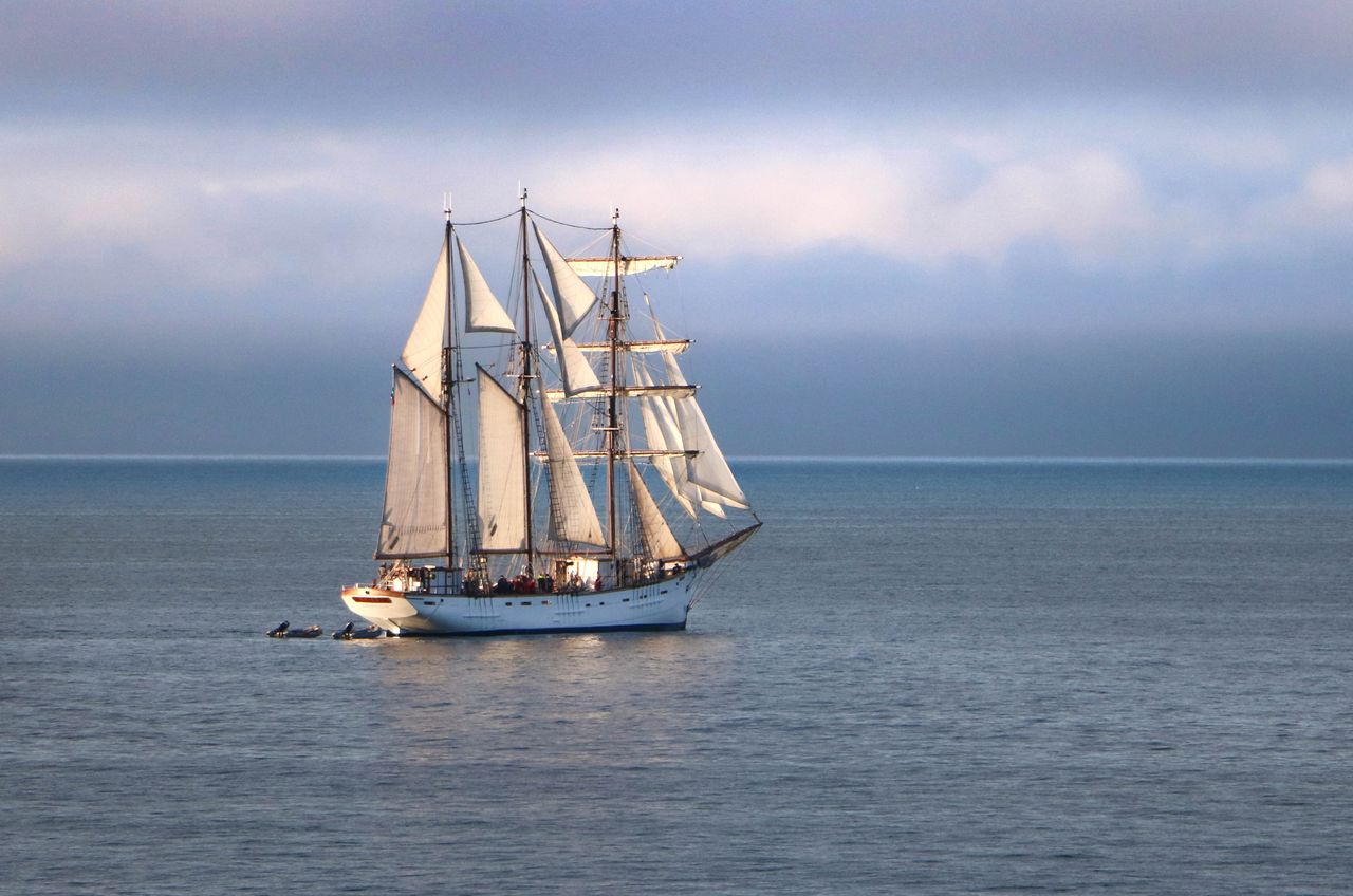 a stunning tall ship sails the calm waters of granville normandie fran