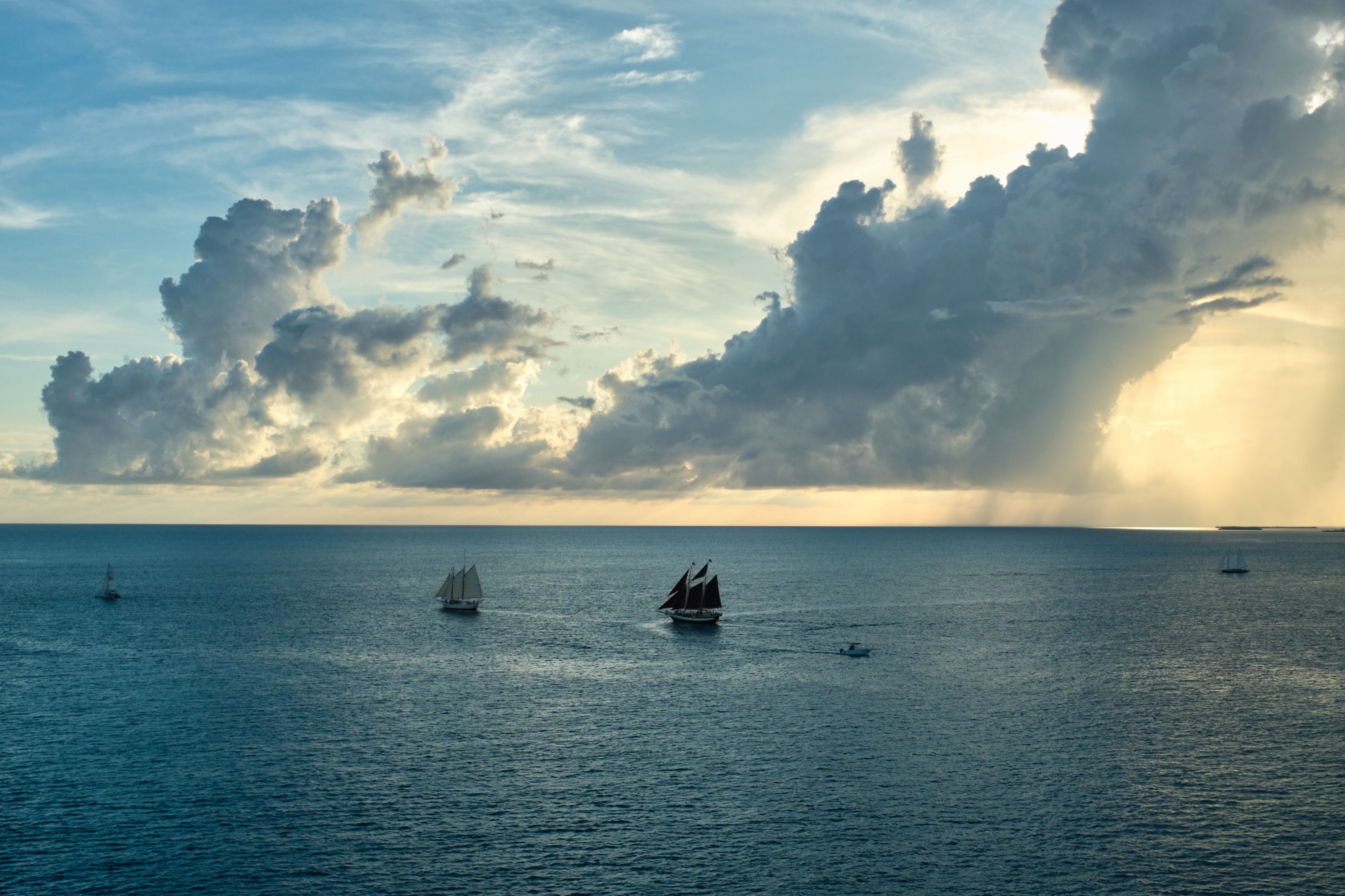 Majestic Sailing Ships at Sea with Dramatic Clouds · Free Stock Photo