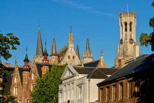 Free Captivating view of historic spires and the Belfry of Bruges in Brugge, Belgium. Stock Photo