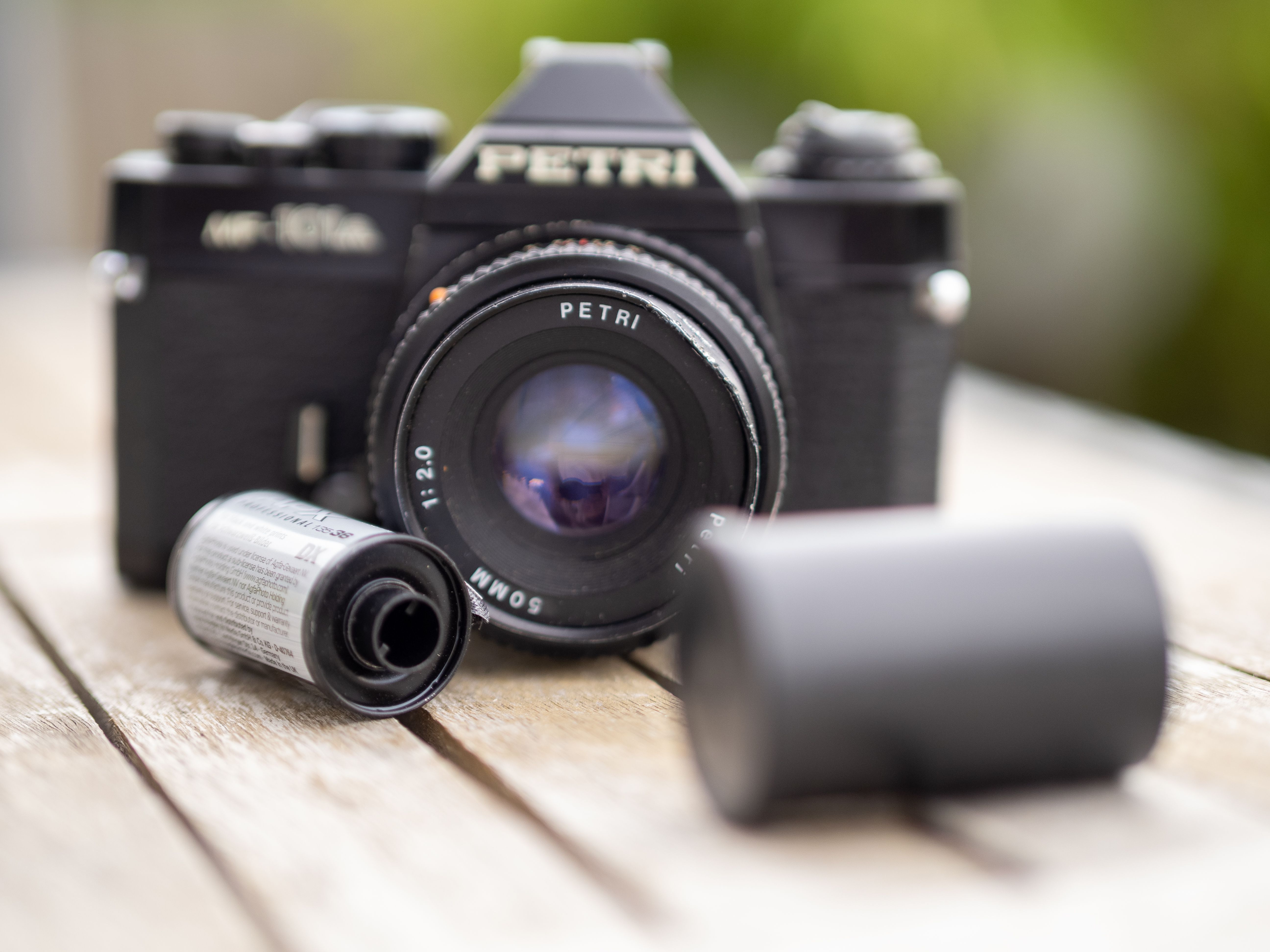Petri SLR with a roll of film