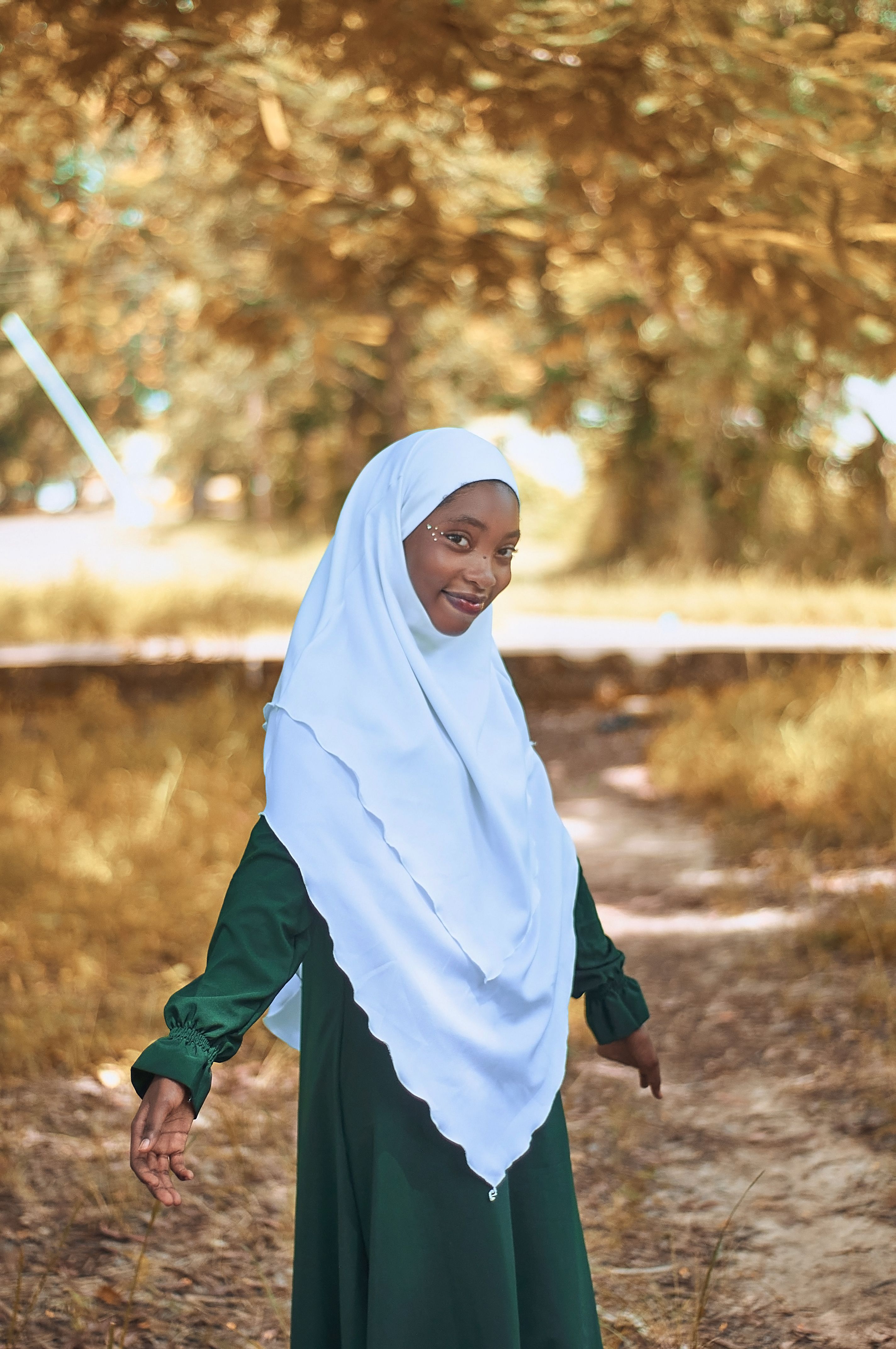 Young Woman in Hijab Walking Outdoors · Free Stock Photo