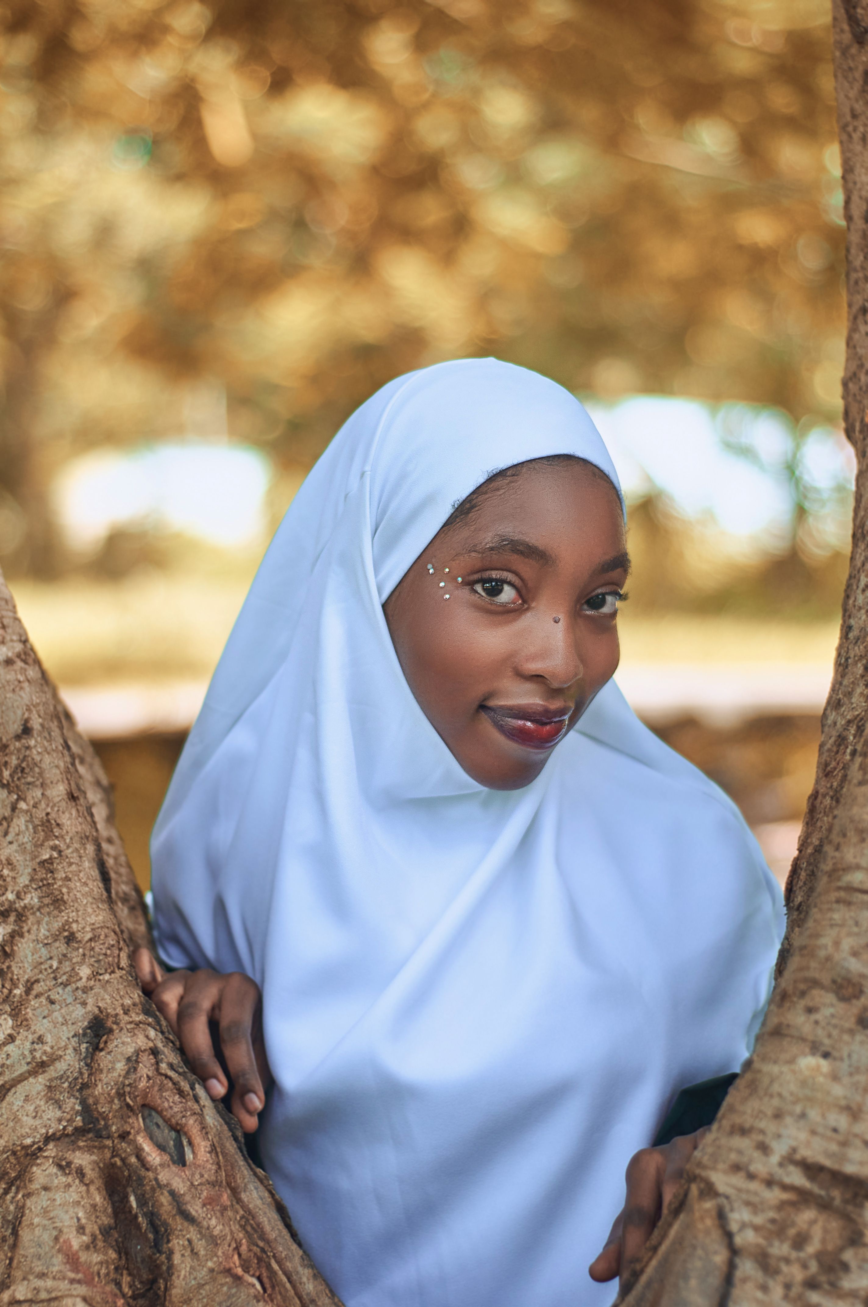 Portrait of a Woman in Hijab Among Trees · Free Stock Photo